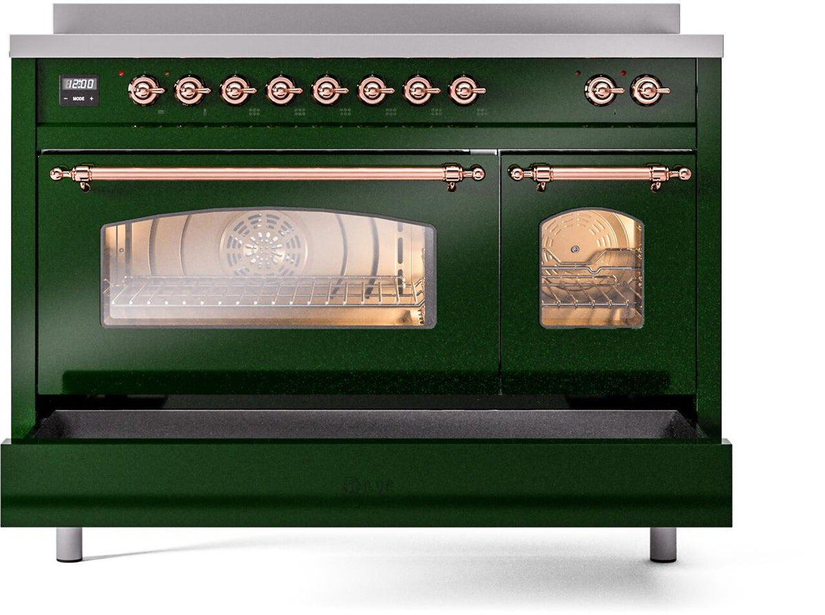 Emerald green oven door open showing glass window, copper rails, and front legs