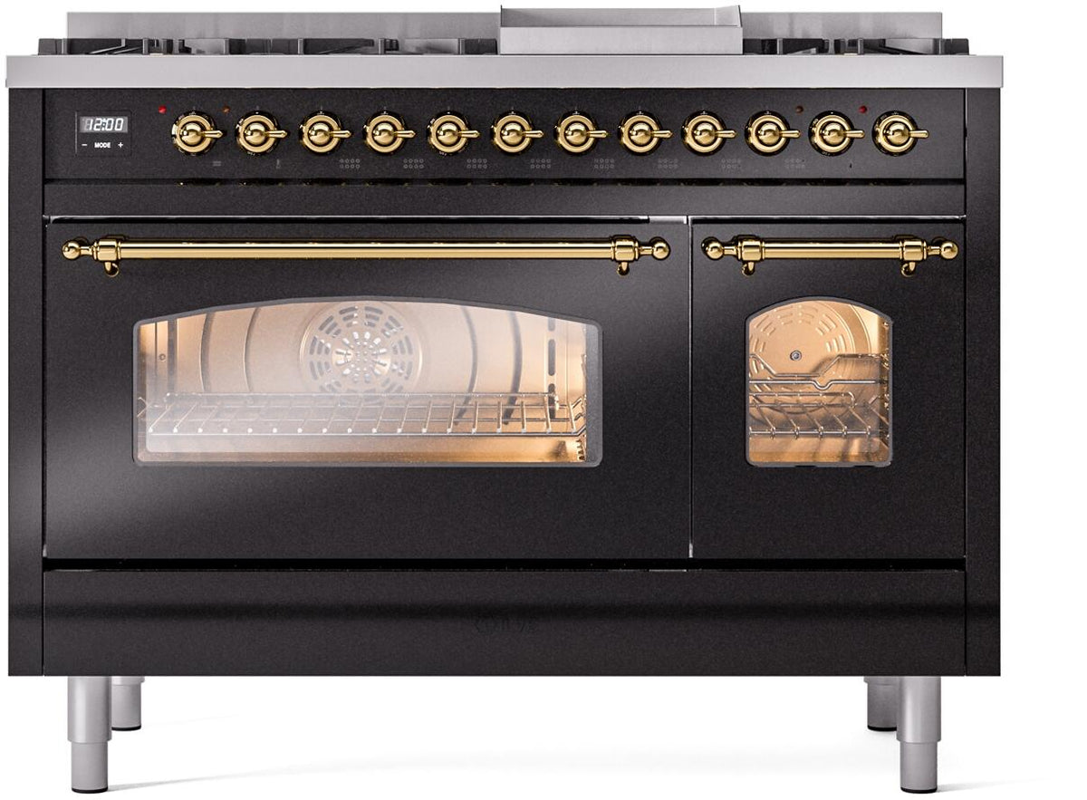 Front view of glossy black freestanding range with glass oven doors and brass accents