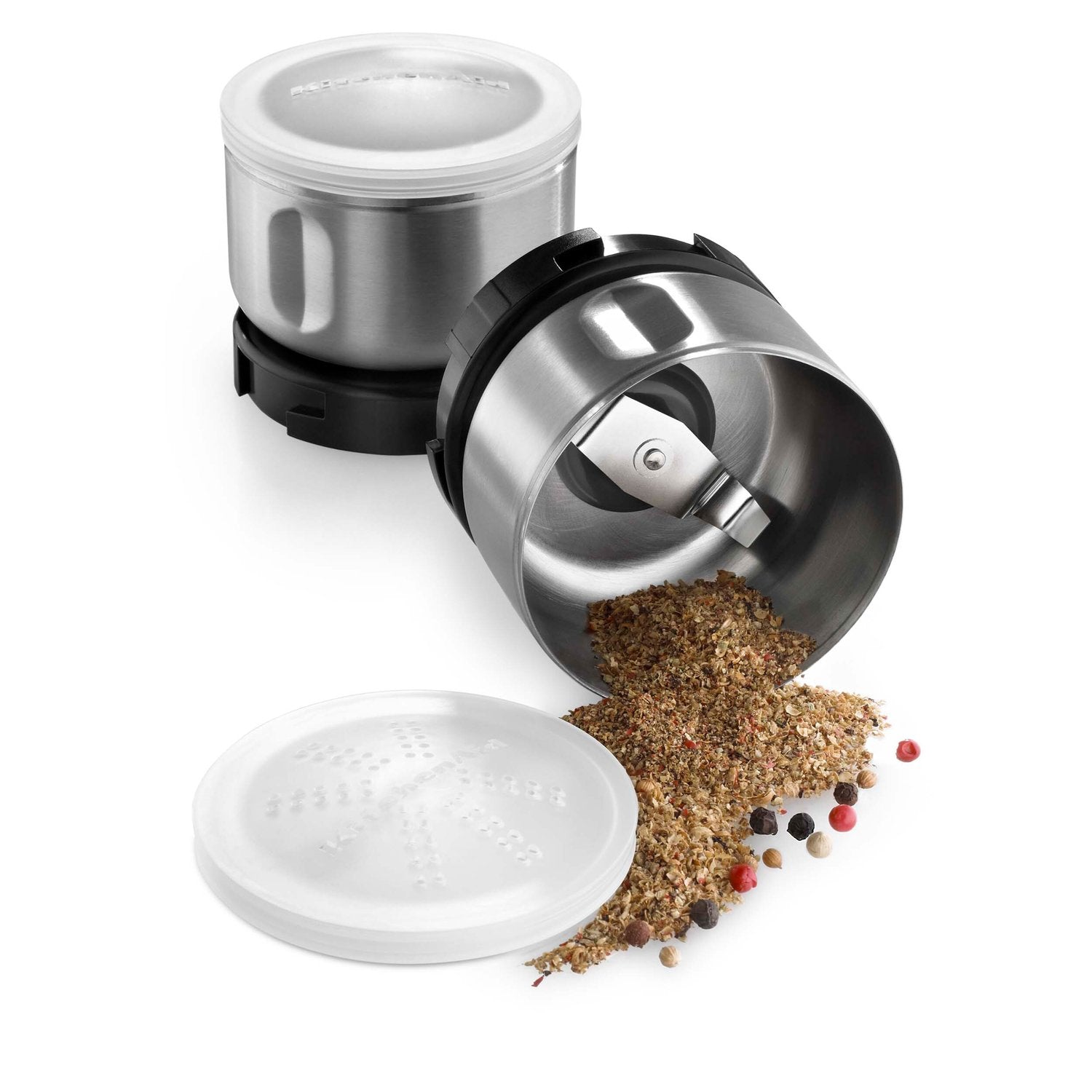 Stainless steel spice grinder cup with black housing, open lid and ground spices