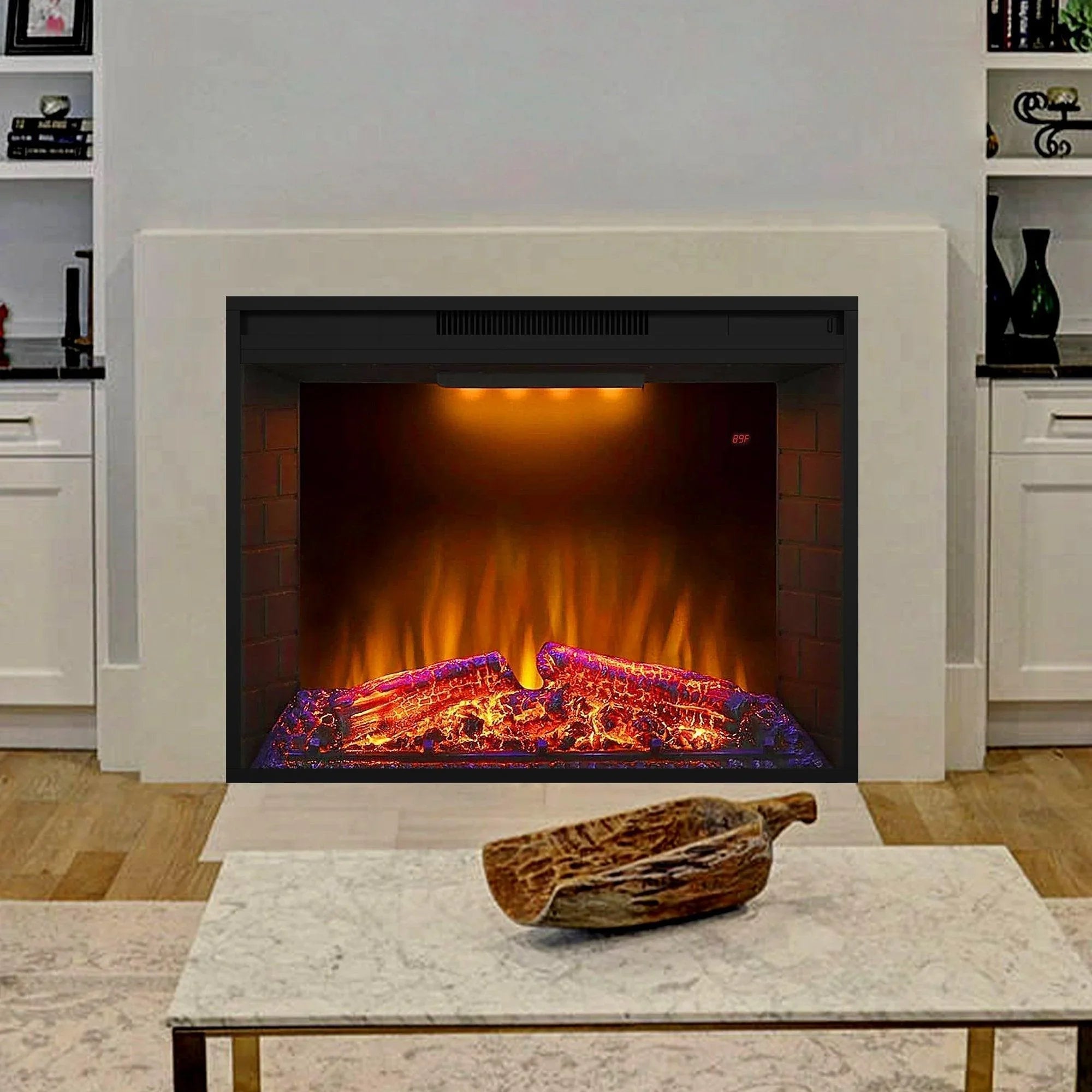 Black electric fireplace heater insert in white mantel, glowing flame bed