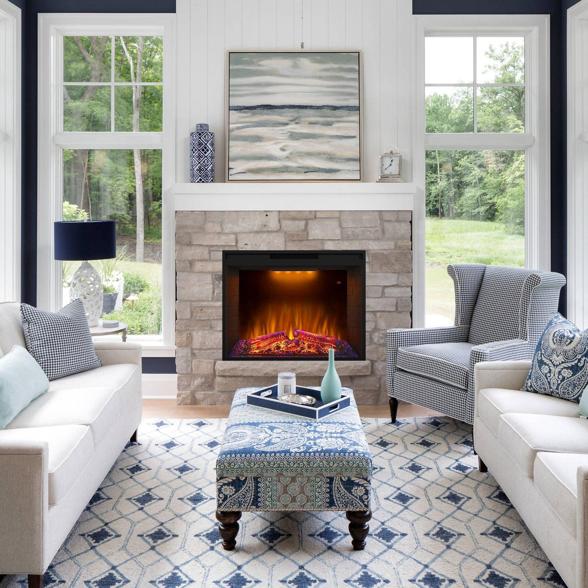 Black electric fireplace heater insert in a family room with flaming log bed