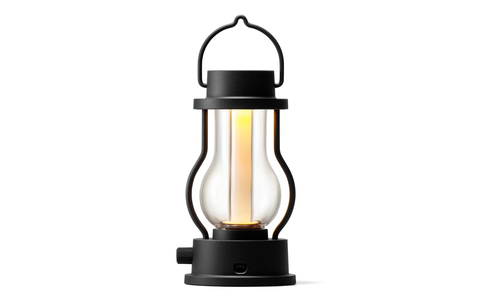 Rechargeable LED lantern in black with curved handle and glowing glass tube
