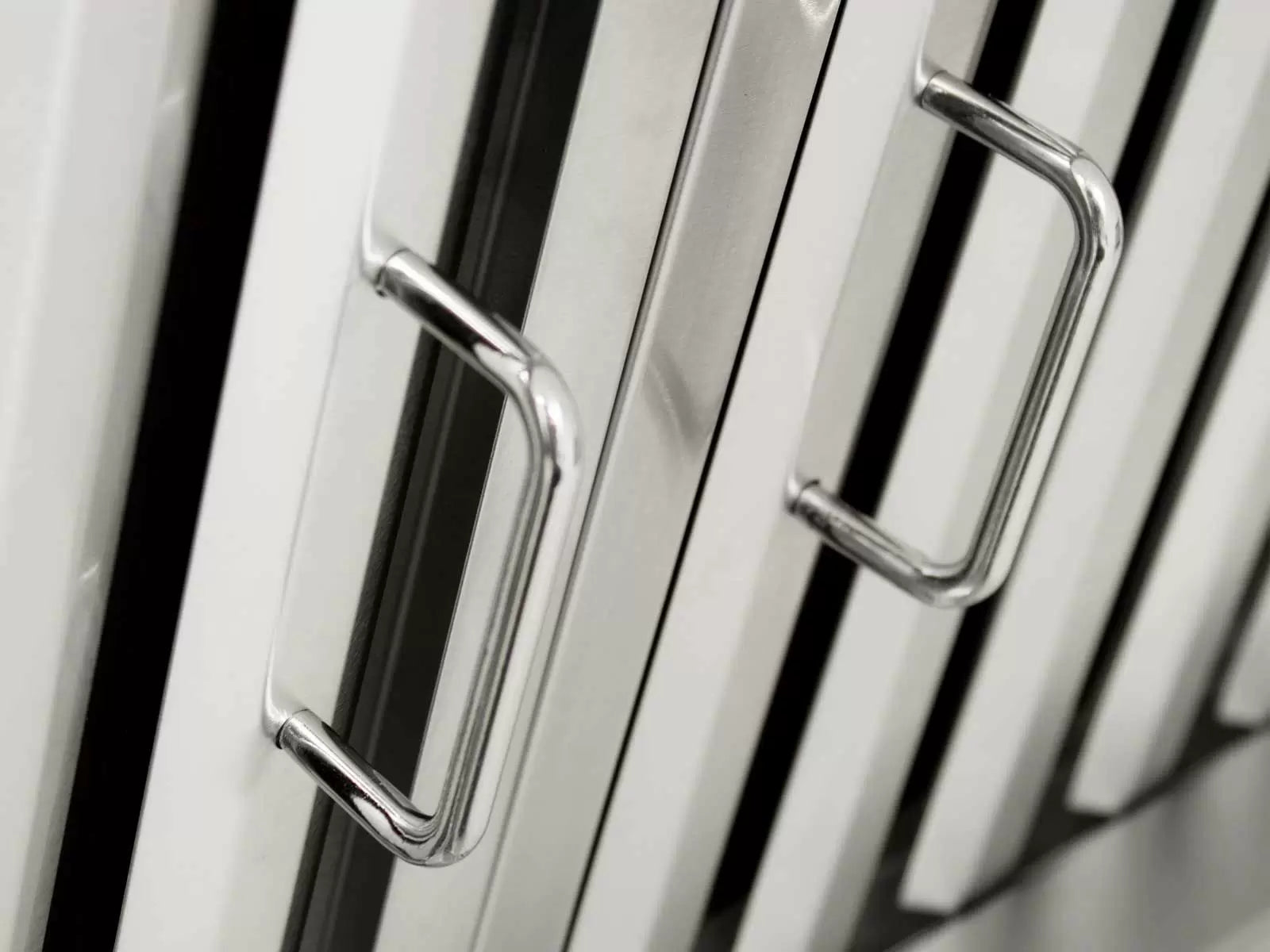 Stainless steel baffle filter with chrome pull handle clips on vent hood