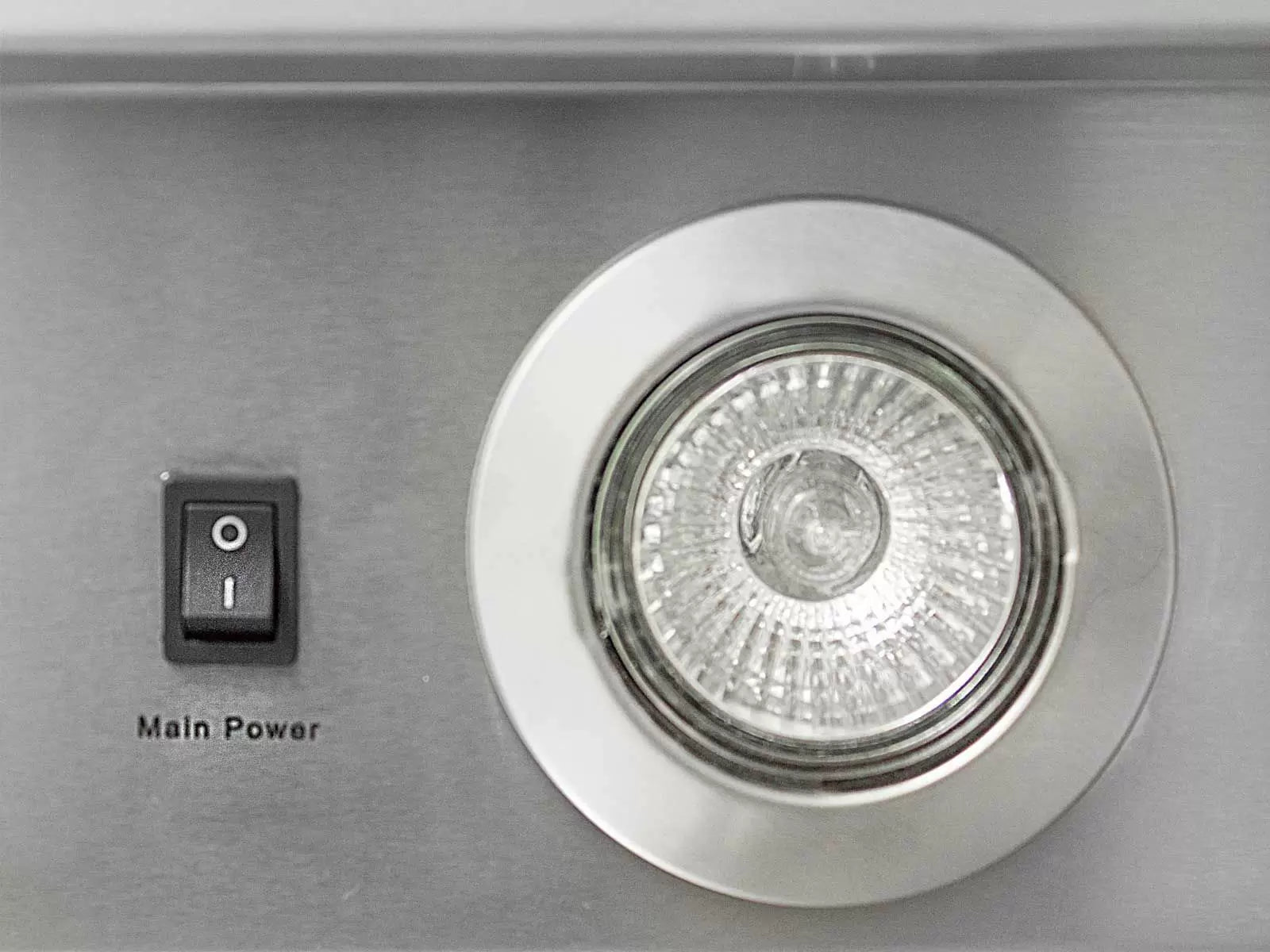 Recessed light and Main Power switch on stainless vent hood front panel