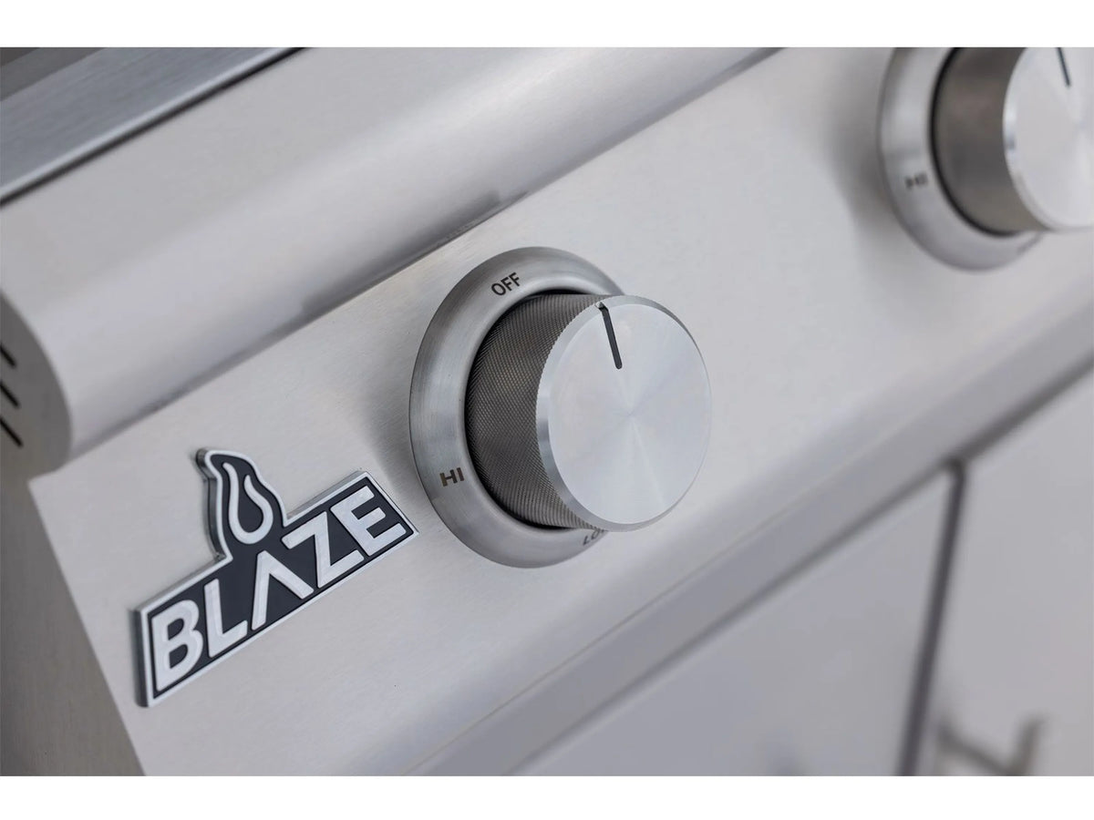Blaze logo on stainless grill panel next to round burner control knob