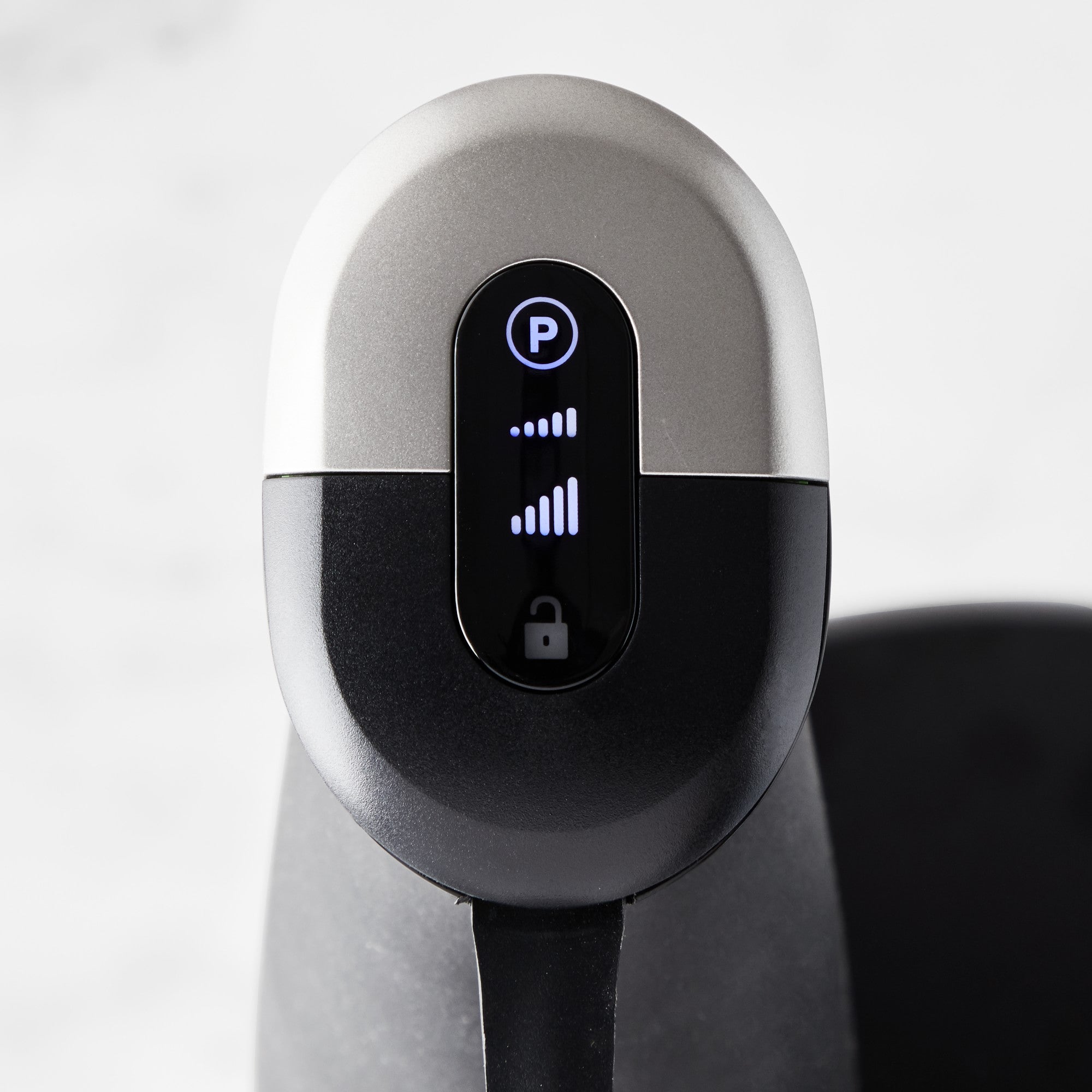 Close-up of Braun hand blender control panel with power and speed buttons.