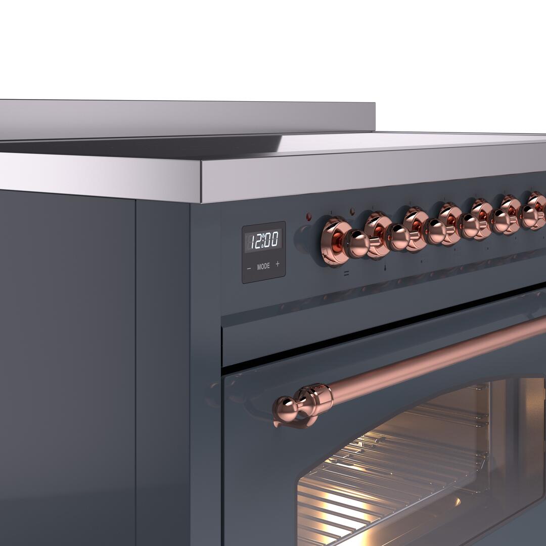 Blue-grey range cooktop edge with digital display and copper control knobs; oven door below.