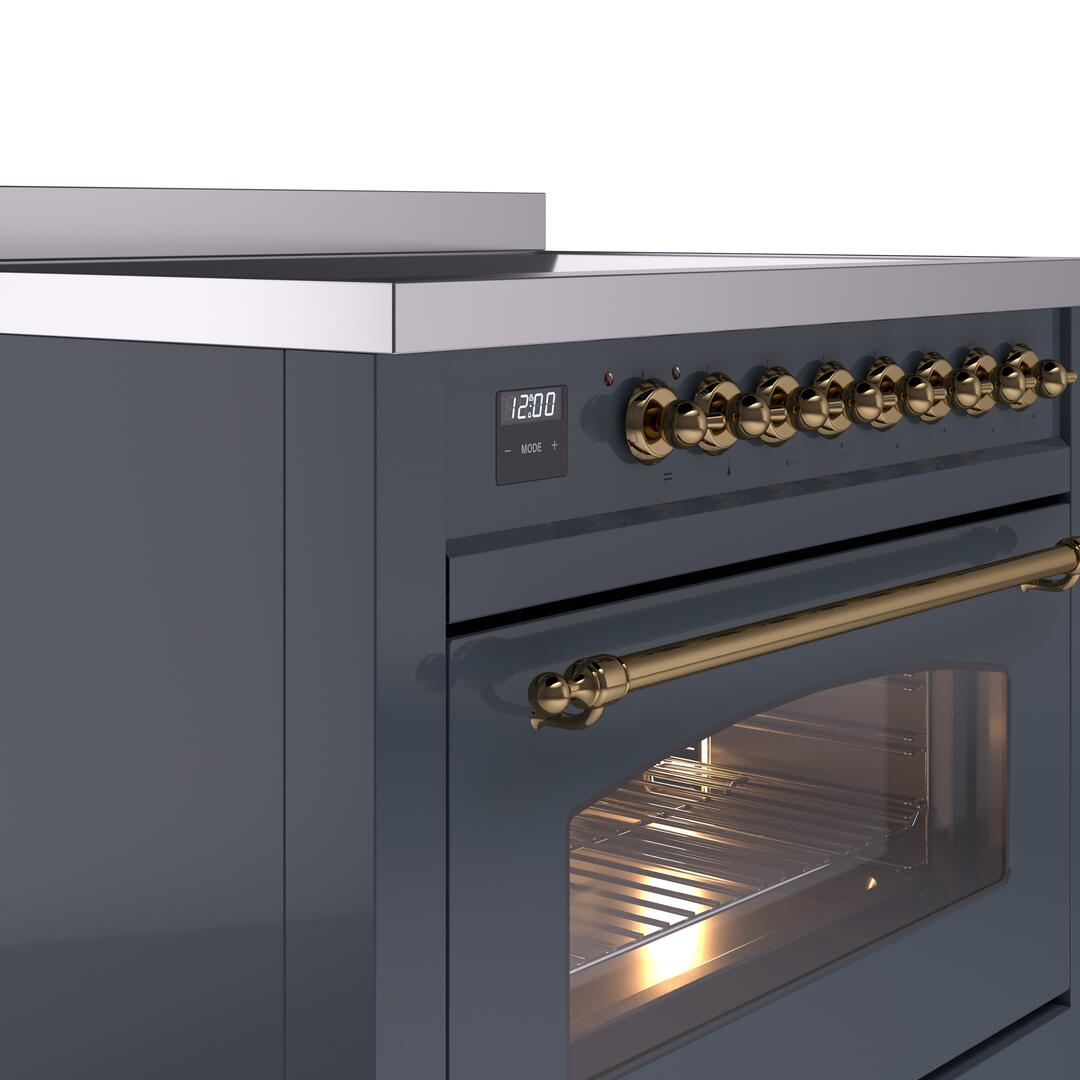 Blue grey induction range control panel with brass knobs and open oven door