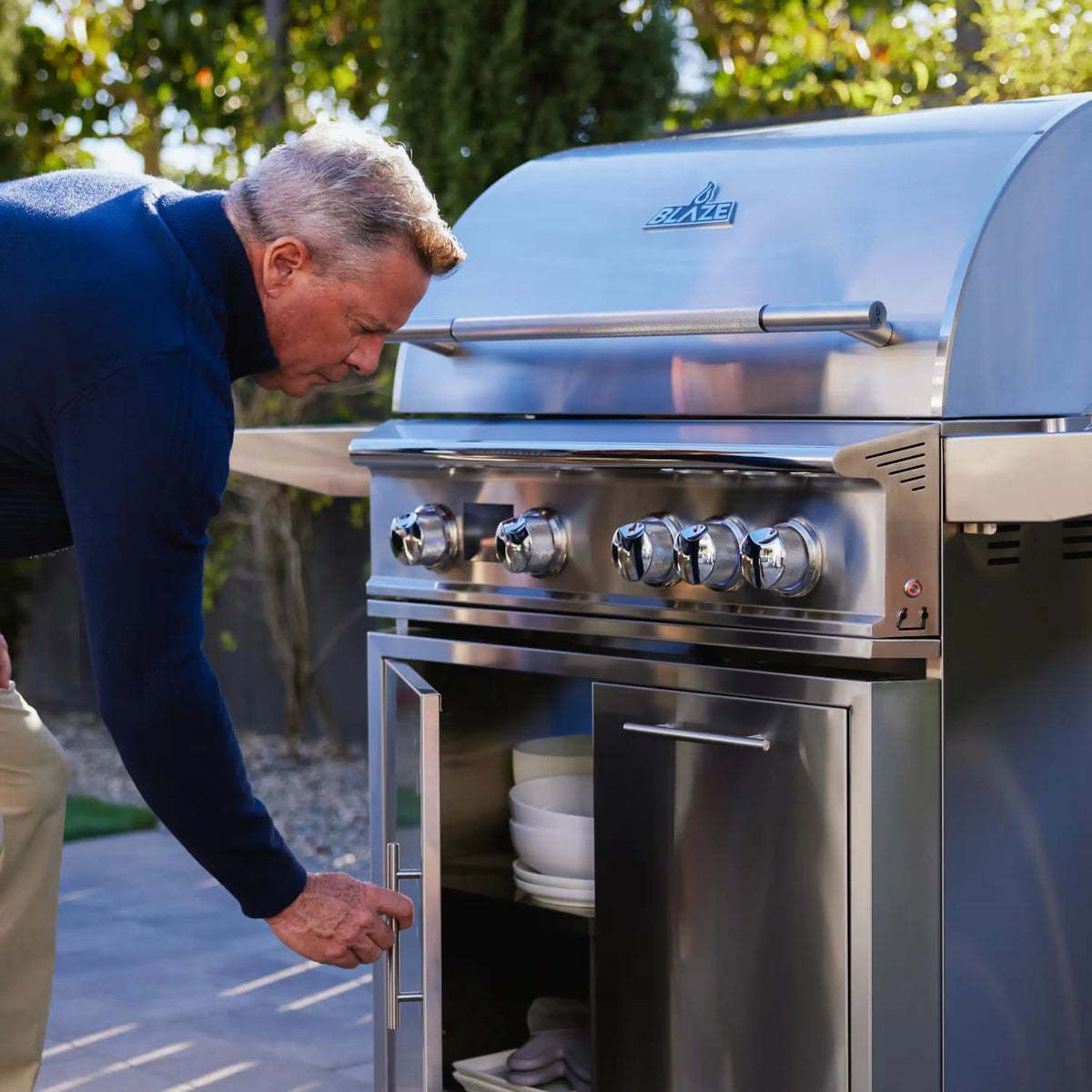 Stainless steel Blaze gas grill cart with side shelves and front control panel