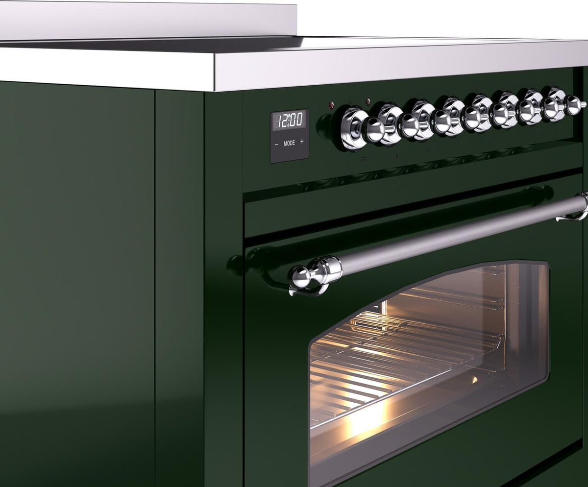 Emerald green induction range control knobs and chrome handle with lit oven window