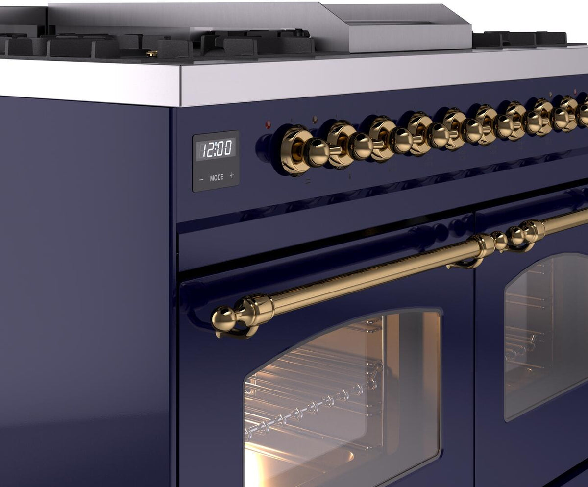 Close-up of midnight blue control panel with brass knobs and digital display