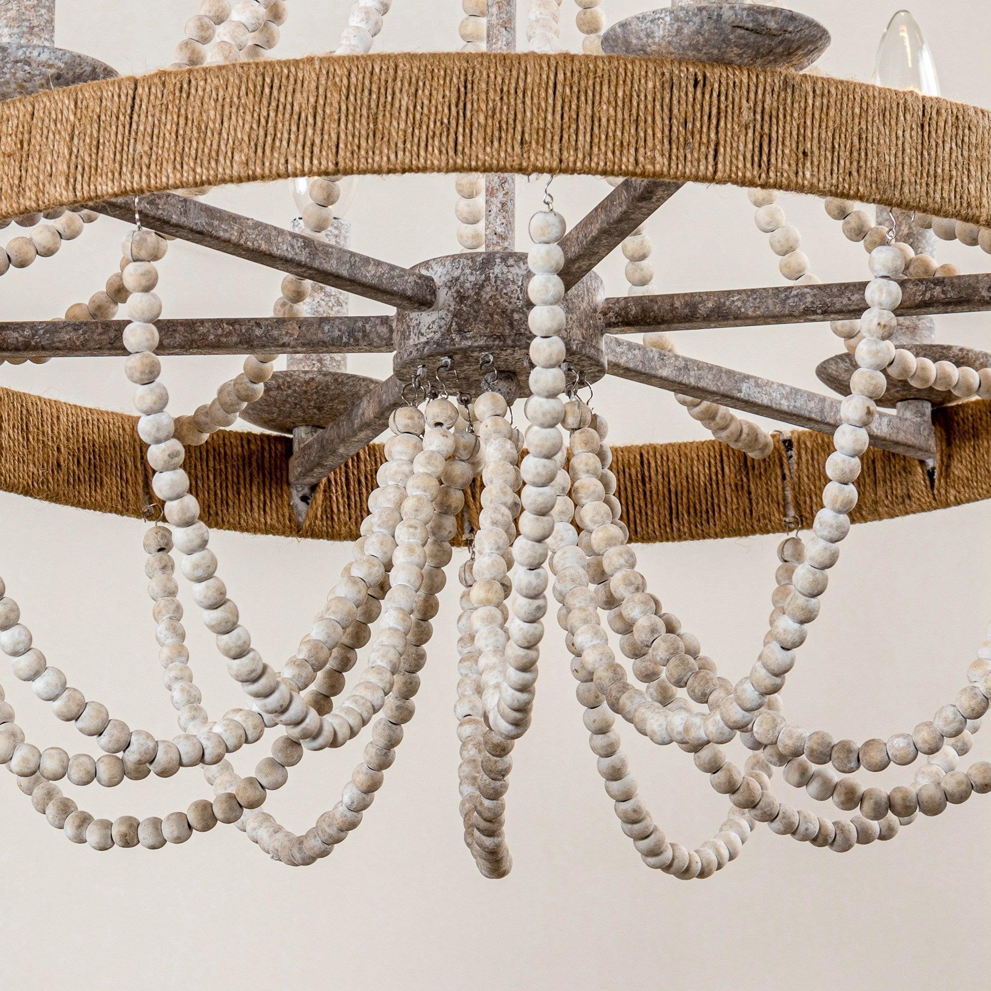 Underside view of beaded chandelier showing white bead loops hanging from the ring