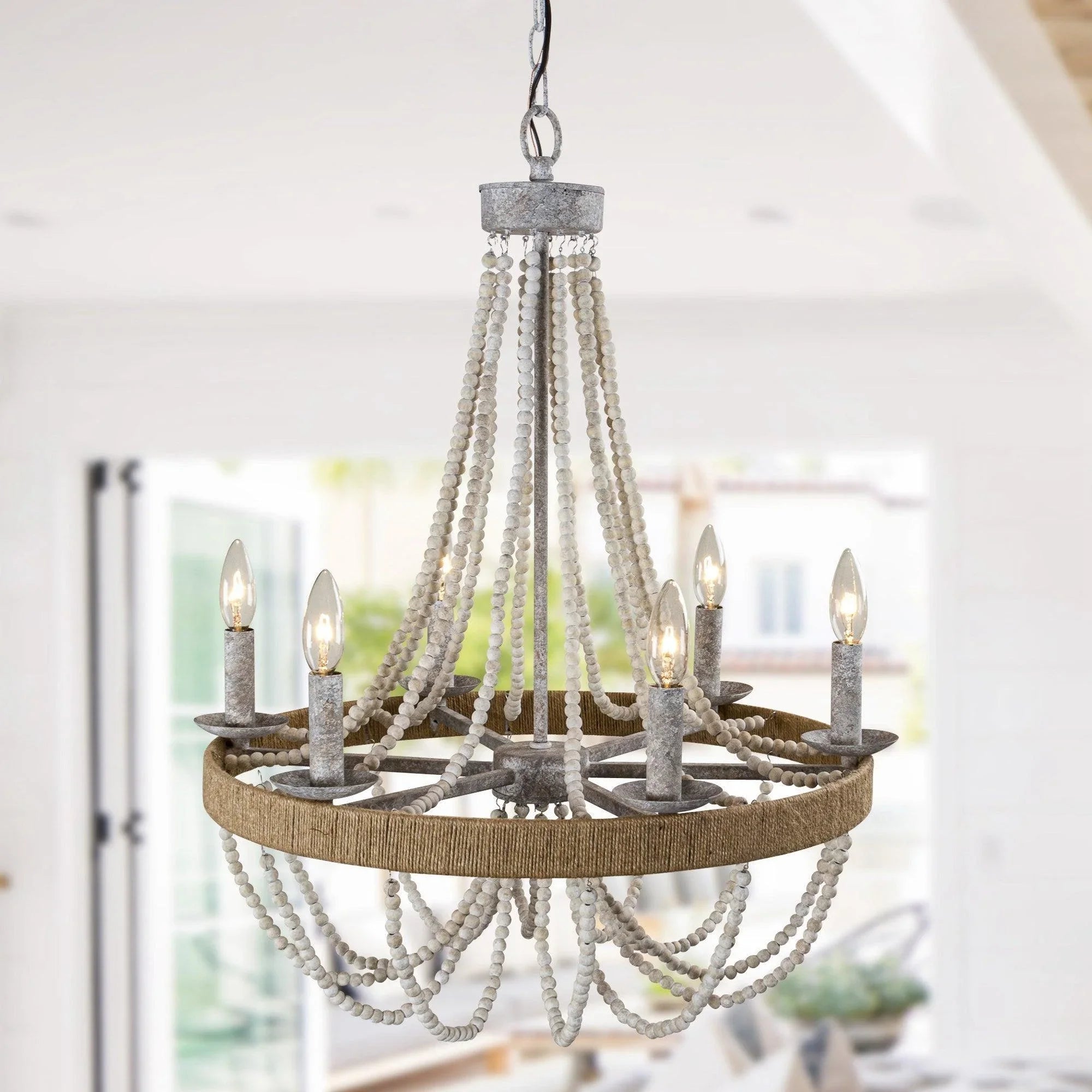 6-light beaded chandelier showing white bead drapes around gray candle sockets