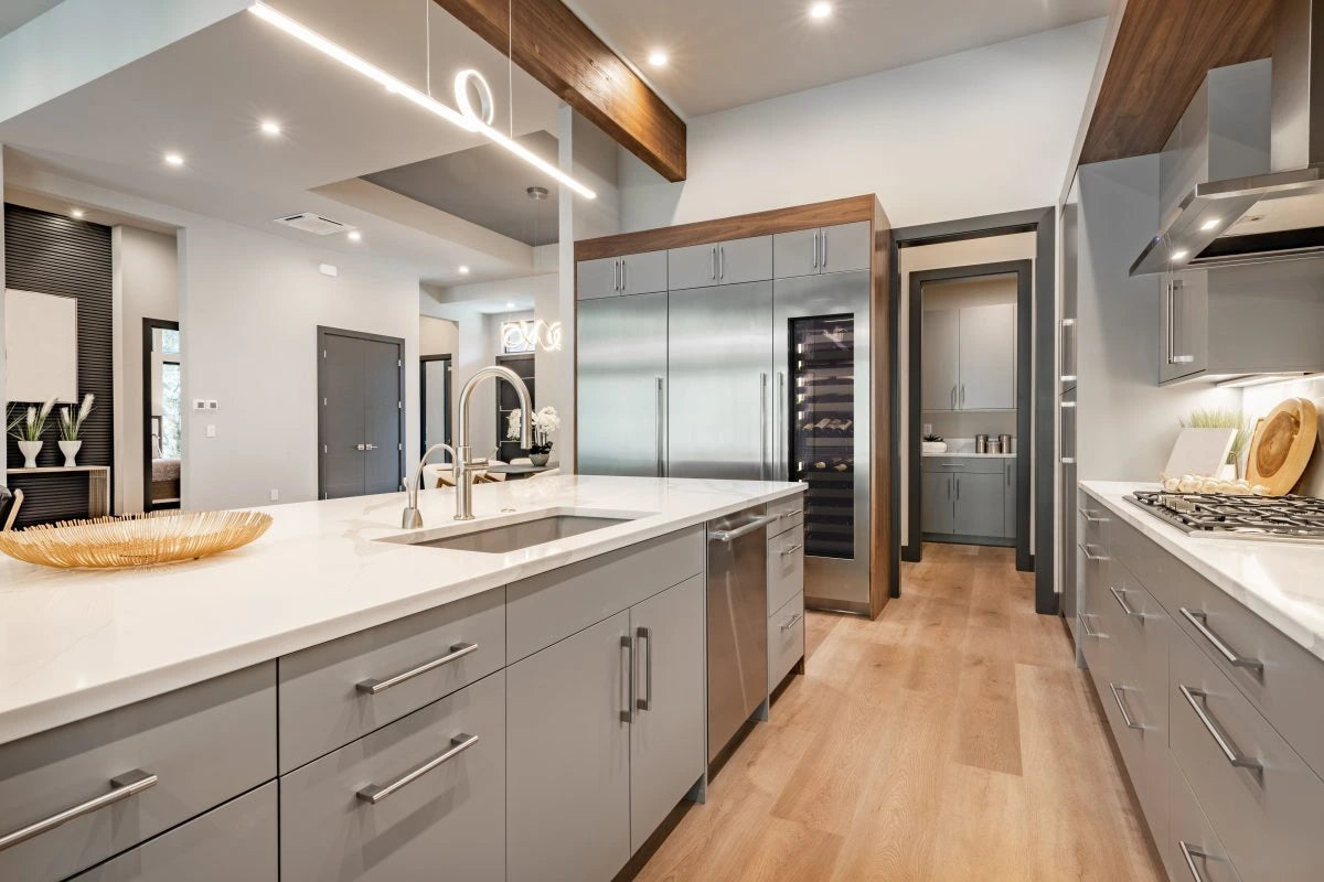Panel-ready dual-zone wine cooler with glass door and interior racks, built-in in kitchen