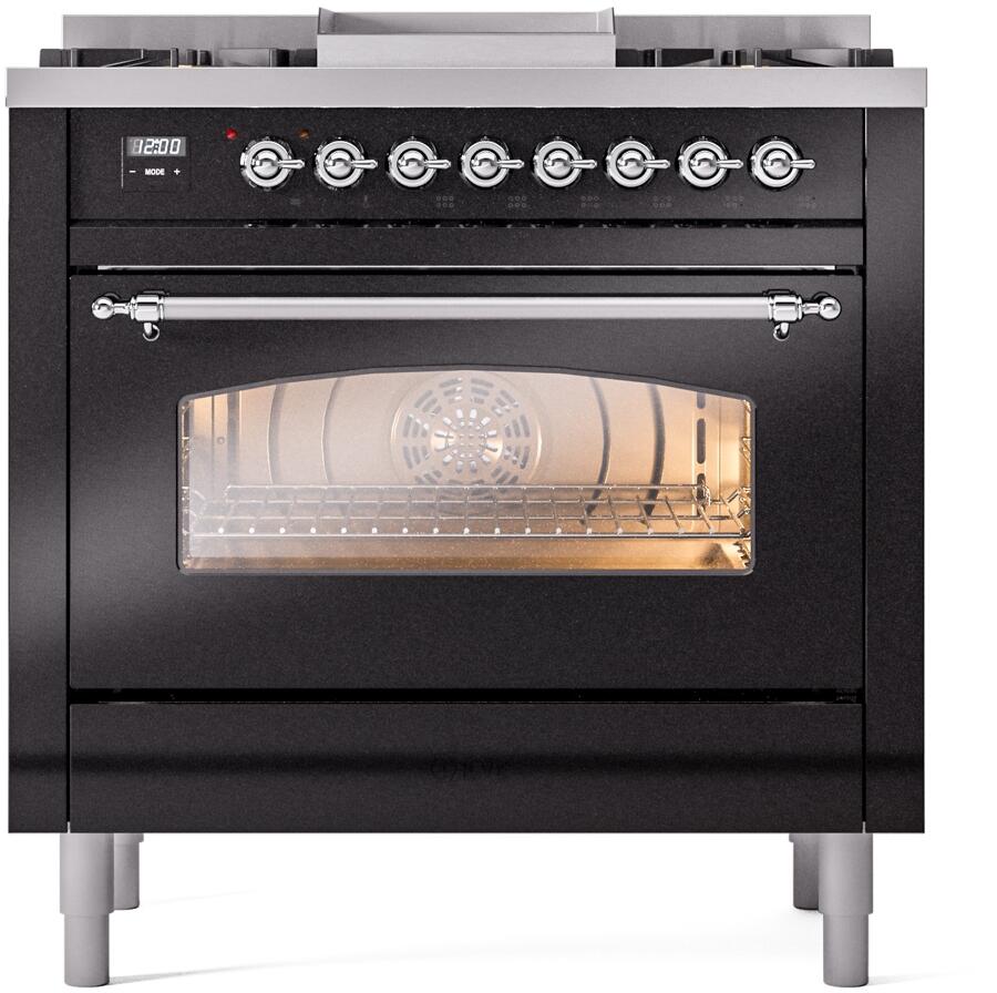 Glossy black dual-fuel range front with control knobs and glass oven door