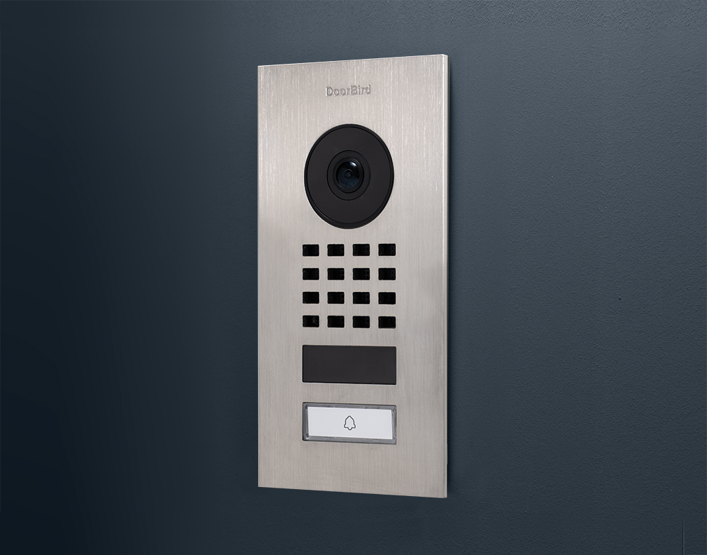 DoorBird D1101V video intercom with camera lens, keypad grid, and nameplate