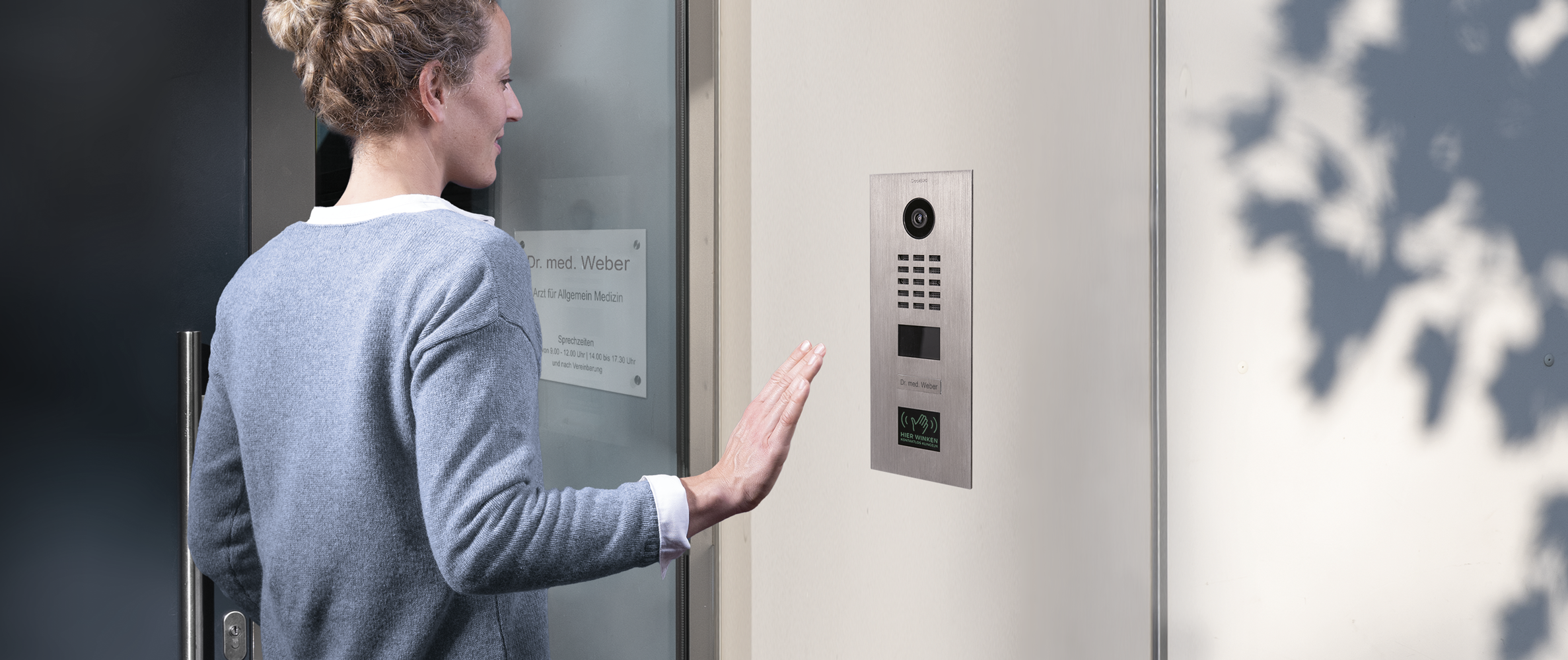 Wall-mounted stainless steel video door station with camera lens and call keypad