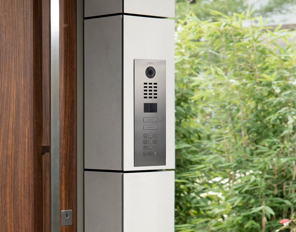 DoorBird IP video door station in grey olive with camera lens and keypad