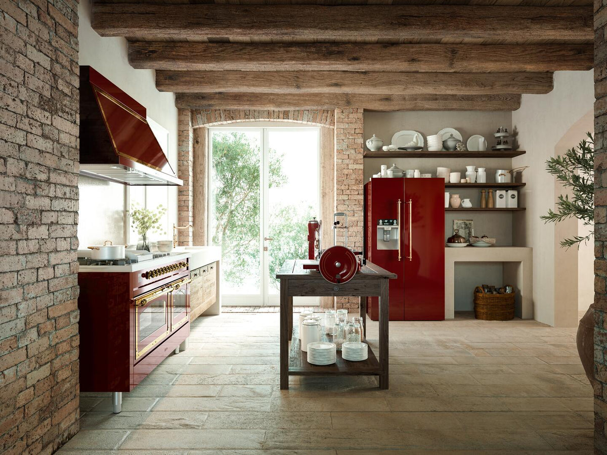 Antique white dual fuel range with chrome accents in a brick and wood kitchen