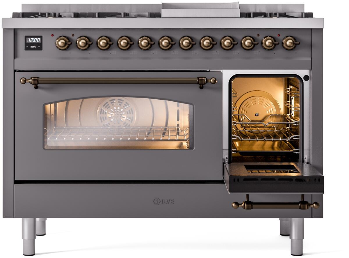 Dual fuel range with left oven window lit and right oven door open, matte graphite