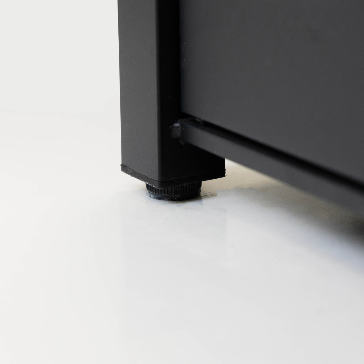 Black propane fire table base with burner control and connection fitting