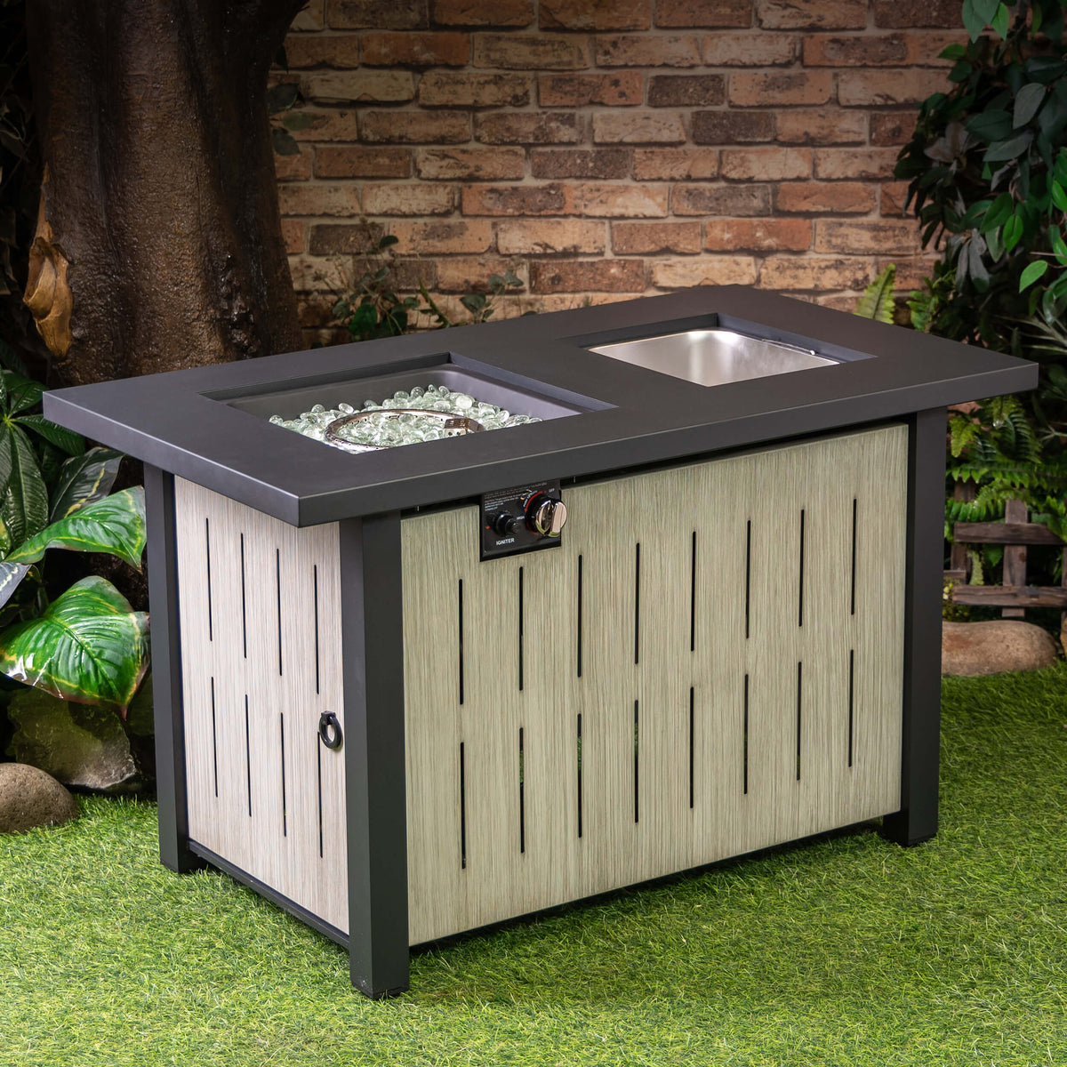 Outdoor firetable with silver ice bucket inserts and open burner section on dark top
