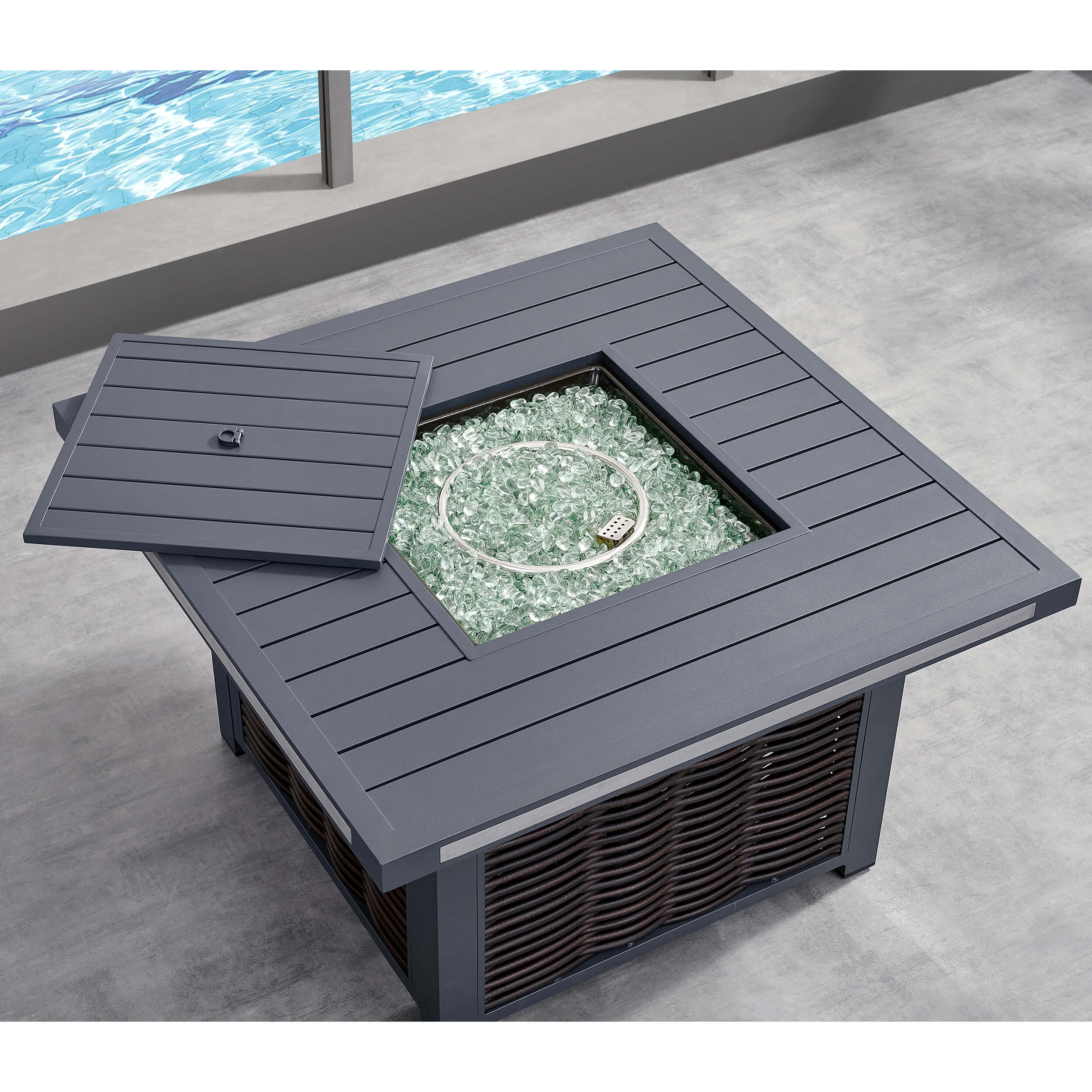 Square dark firepit with open lid and glass fire beads inside