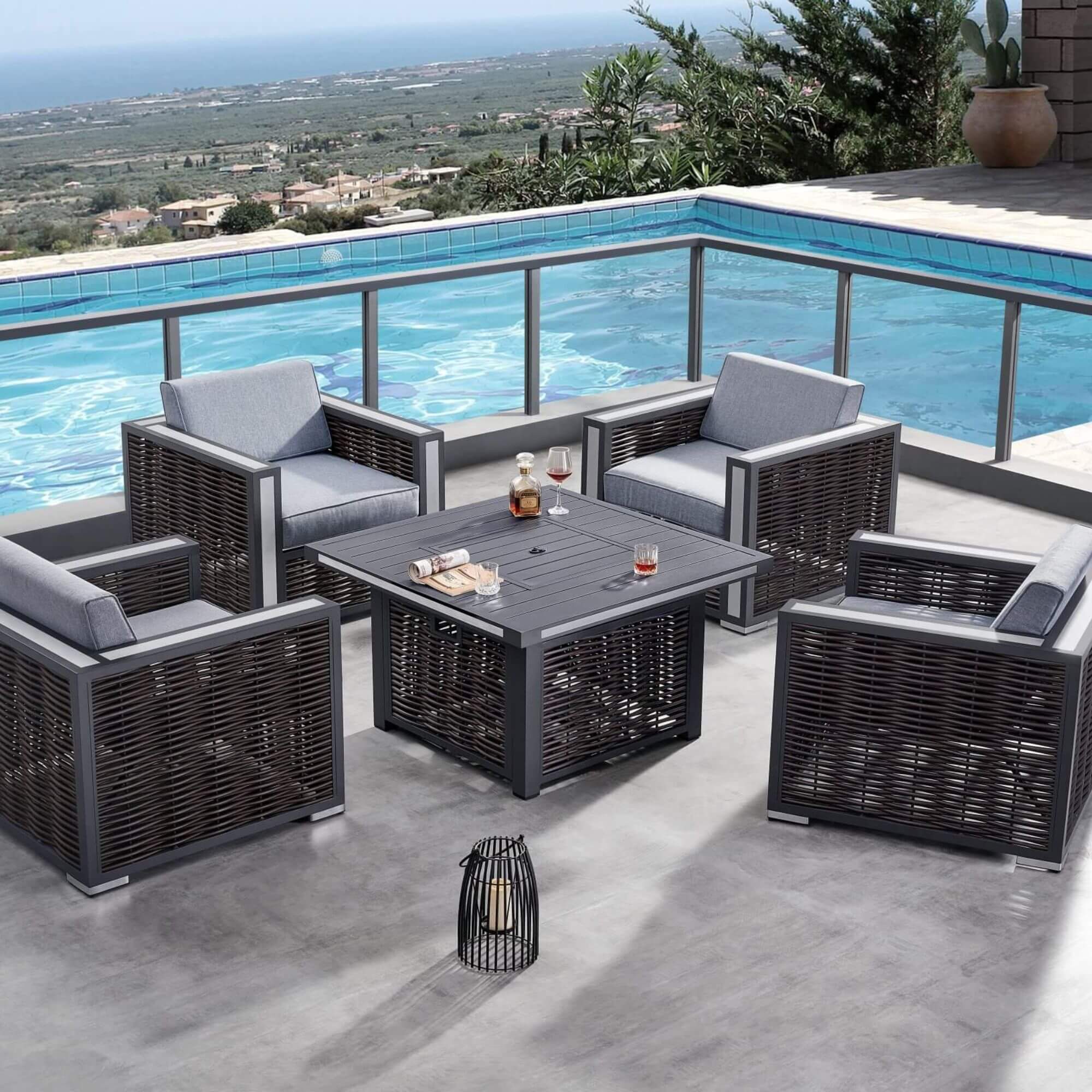 Outdoor patio seating set with four armchairs and firepit table, gray cushions