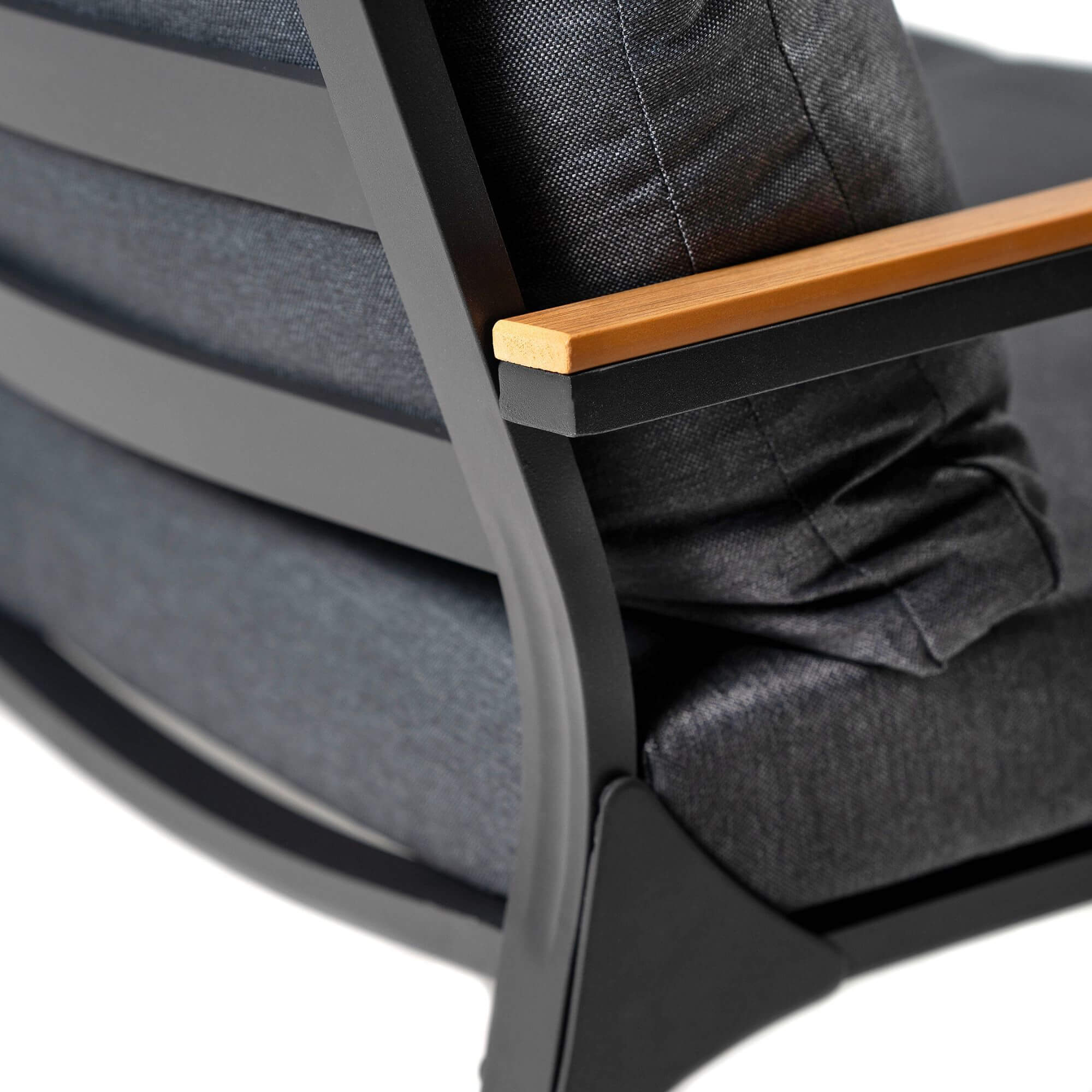 Outdoor sofa armrest and dark fabric cushion with wooden trim