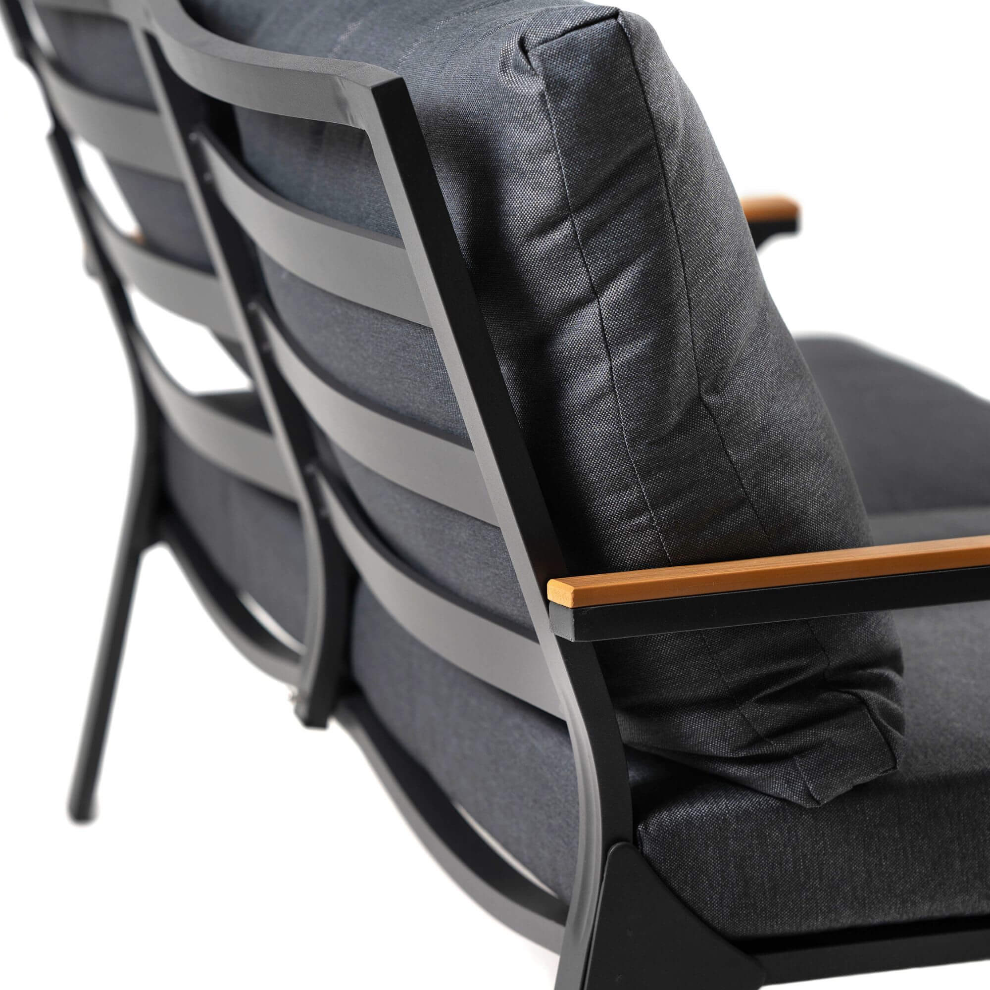 Outdoor sofa chair back and armrest with dark gray cushions and light wood trim