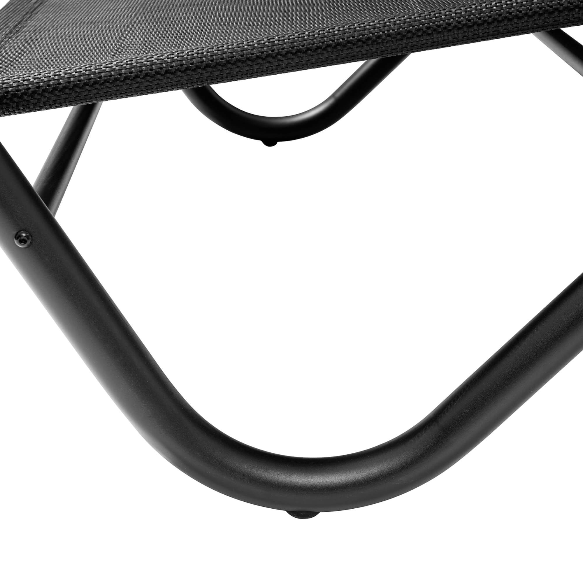 Curved black steel frame base under woven seat on outdoor lounge daybed