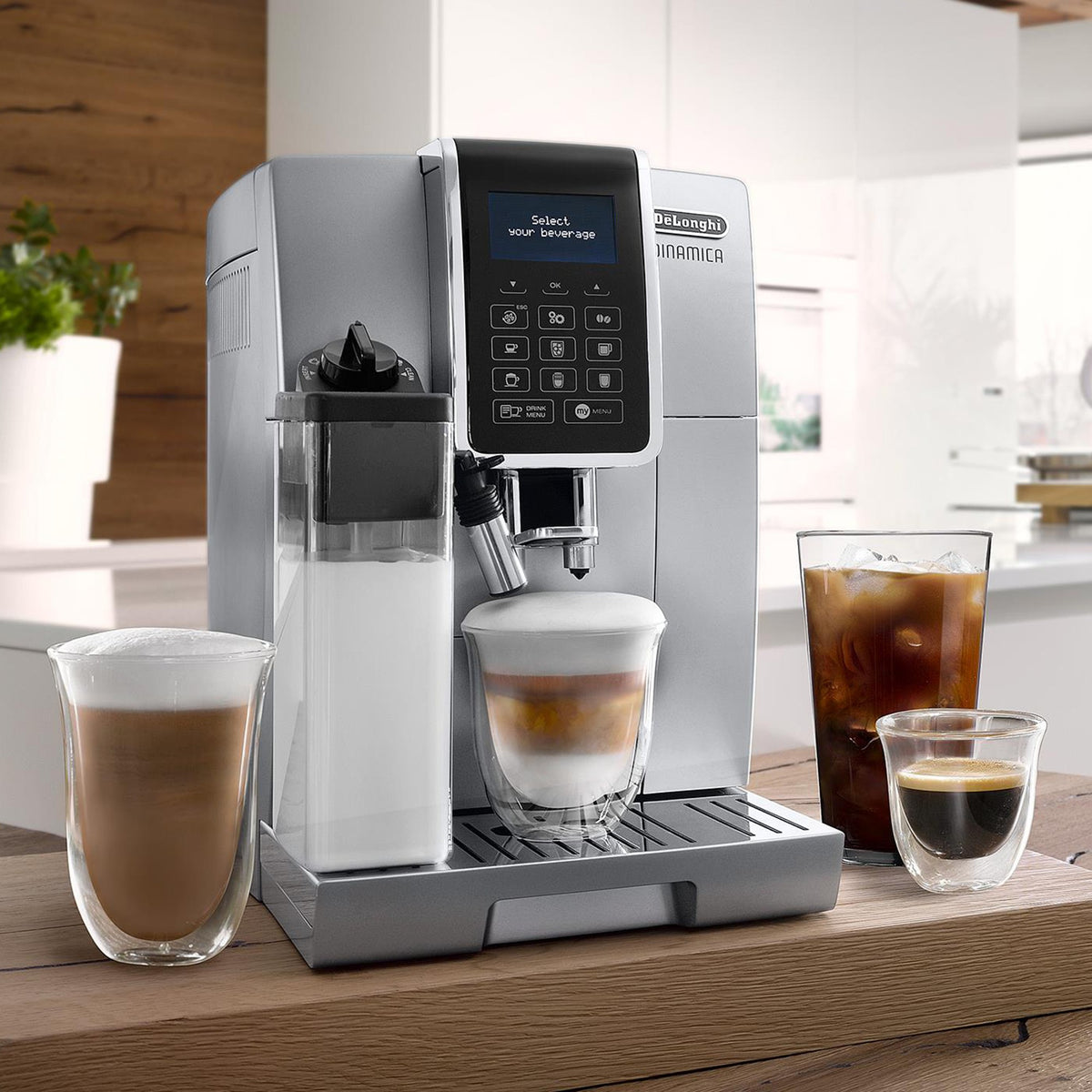 Silver super-automatic espresso machine with frothing spout and control panel