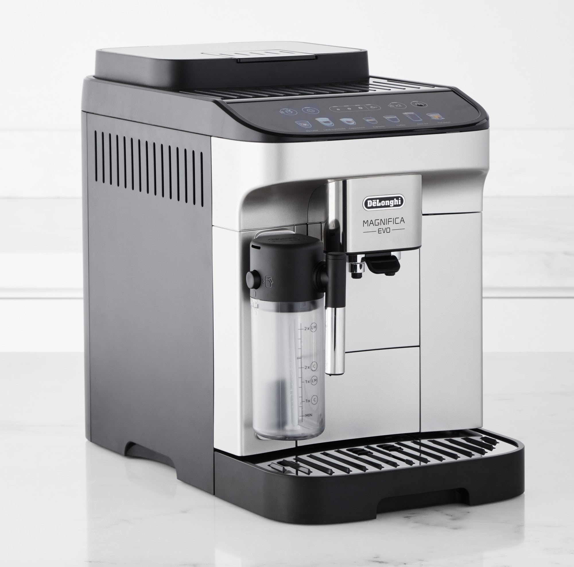 De'Longhi Magnifica Evo coffee machine side view with dispensing spout and water tank