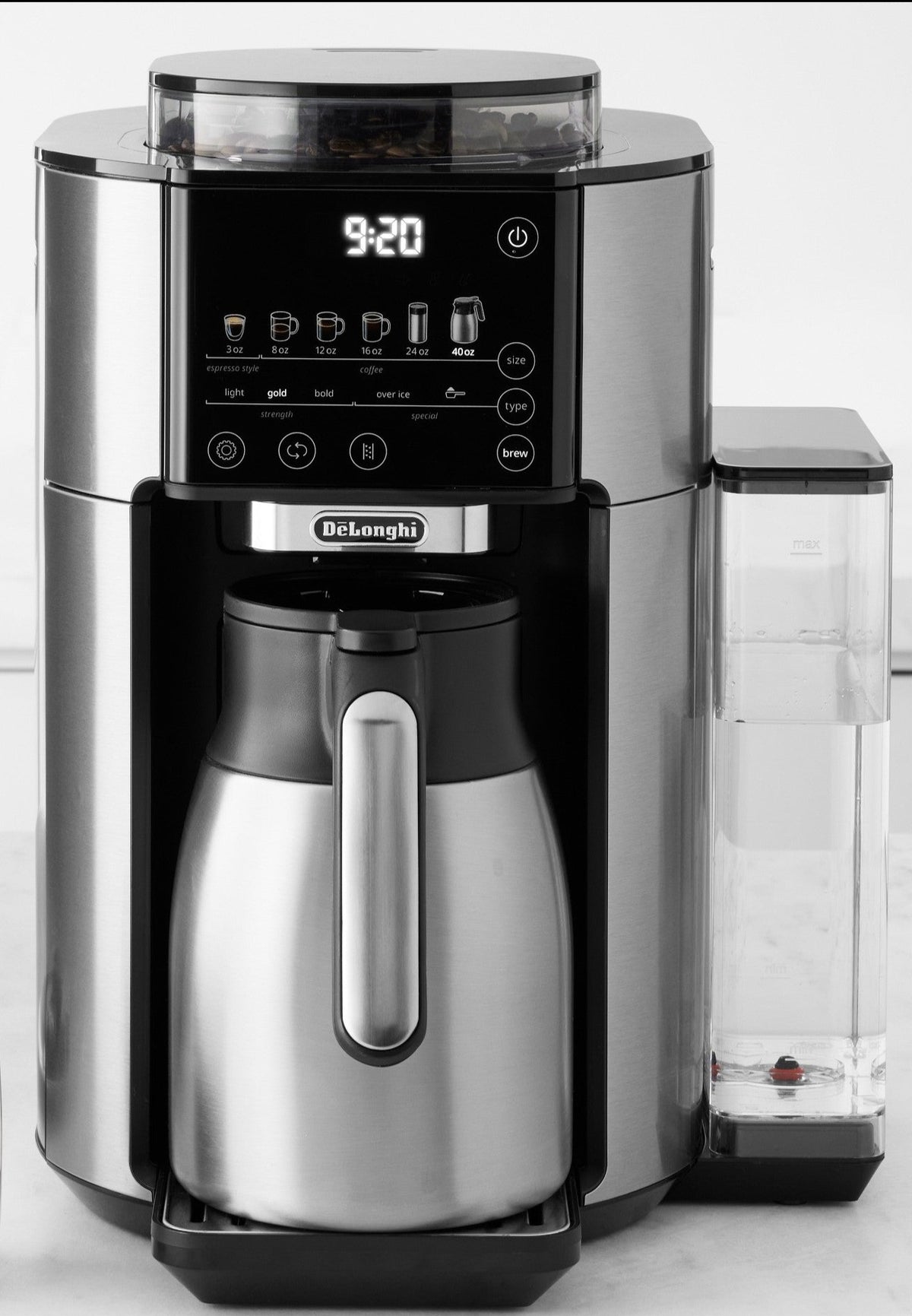 Compact view of stainless automatic coffee maker with black control display and carafe