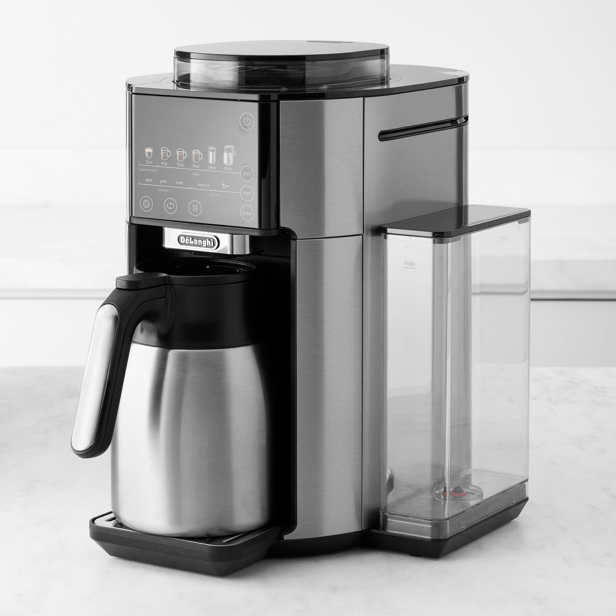 Stainless steel automatic coffee maker with black handle, thermal carafe, and front tray