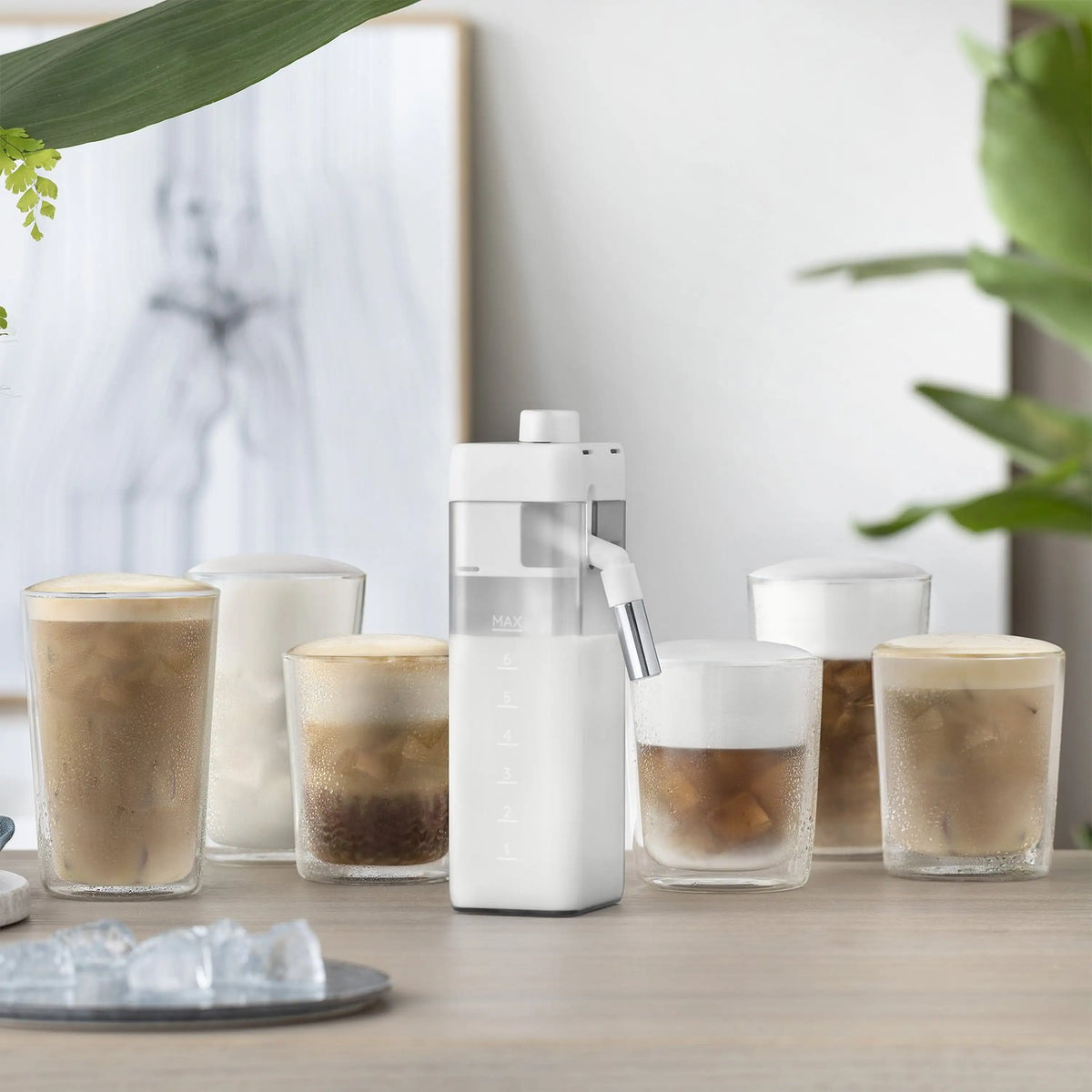 White LatteCream Cool accessory beside clear cups filled with iced coffee
