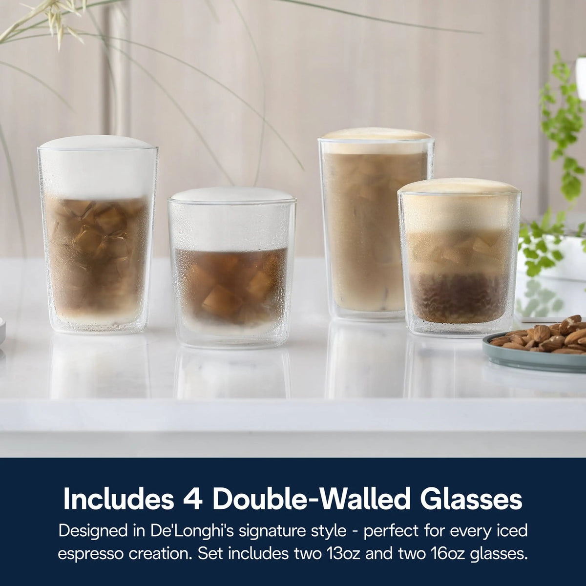 Four double-walled iced coffee glasses with layered milk and coffee