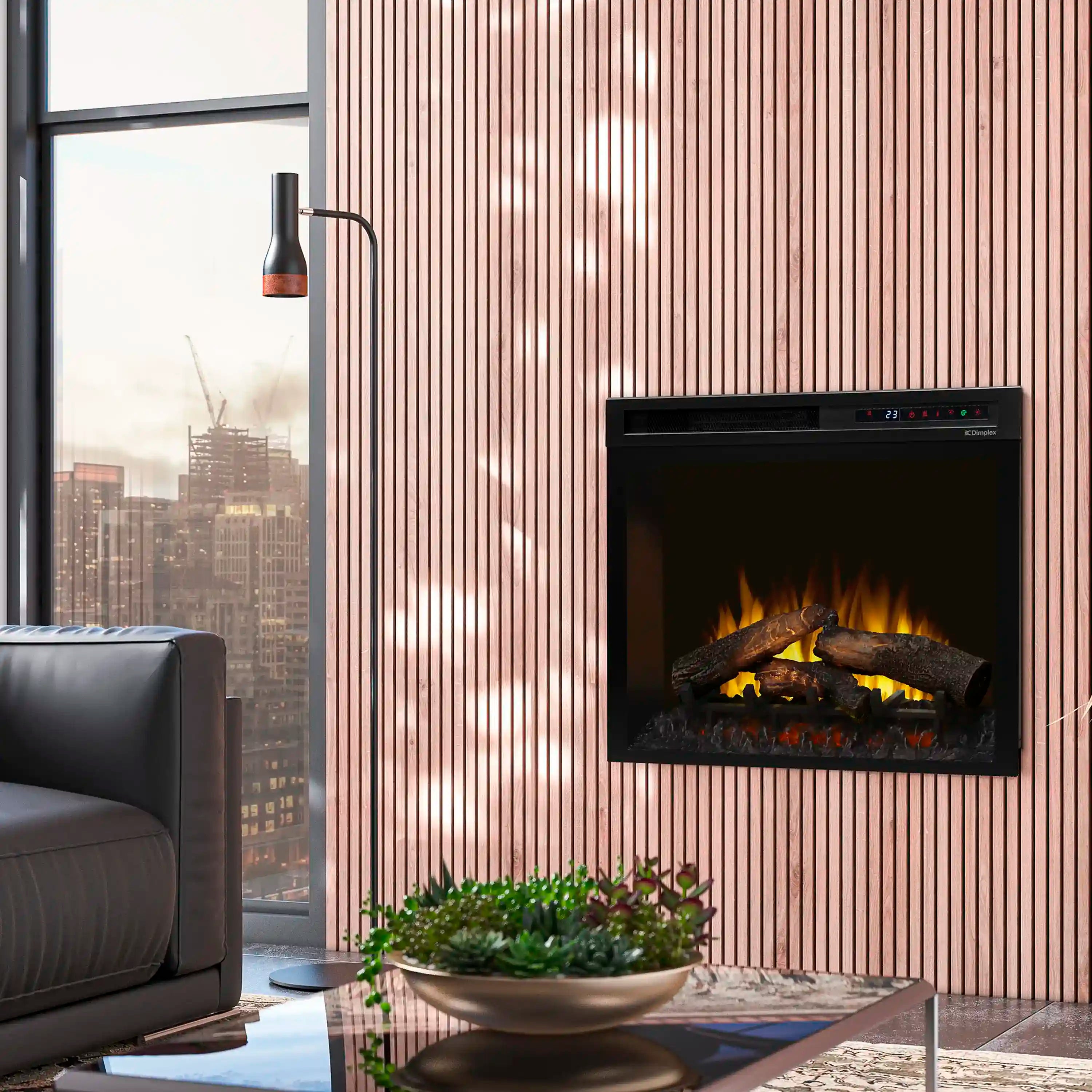 Dimplex plug-in electric firebox installed in a wall with glowing log flames