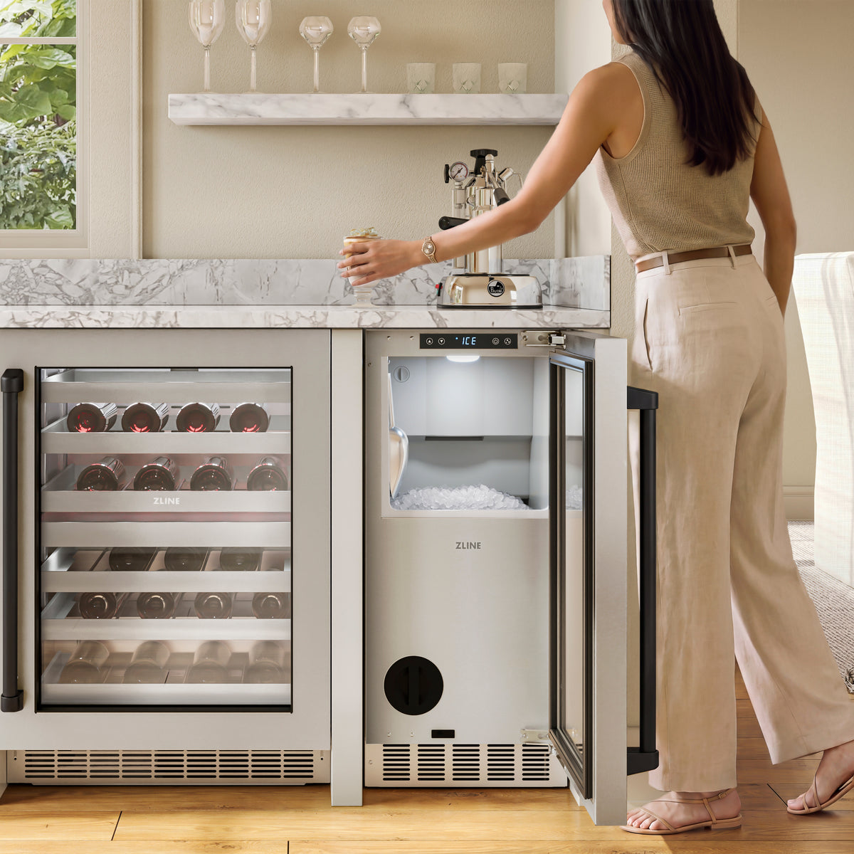 Serving nugget ice from the ZLINE Autograph Edition ice maker in an outdoor bar (INGDZ-ST-15-MB)