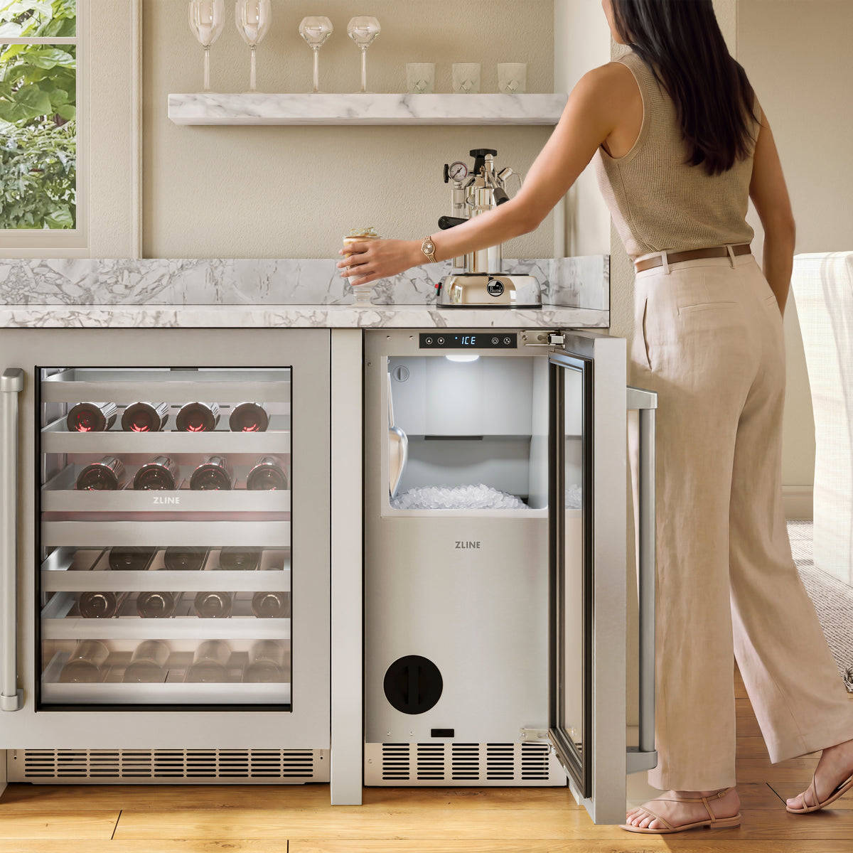 Serving nugget ice from the ZLINE stainless steel ice maker in an outdoor bar (INGD-ST-15)