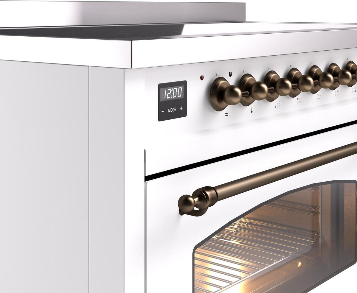 White freestanding induction range control panel with bronze knobs and clock display