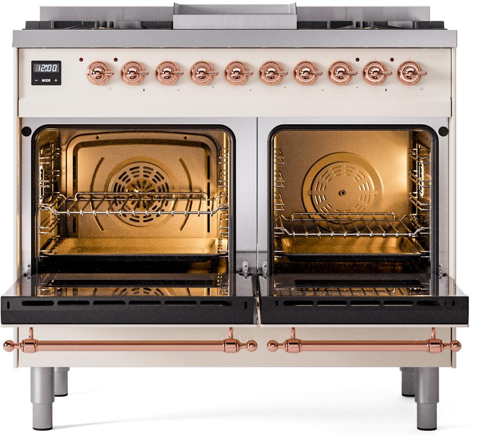 Dual fuel range with both oven doors open and warm interior light, copper handles