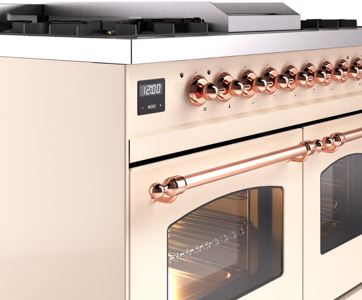 Control panel detail with copper knobs and large copper rail handle on antique white range