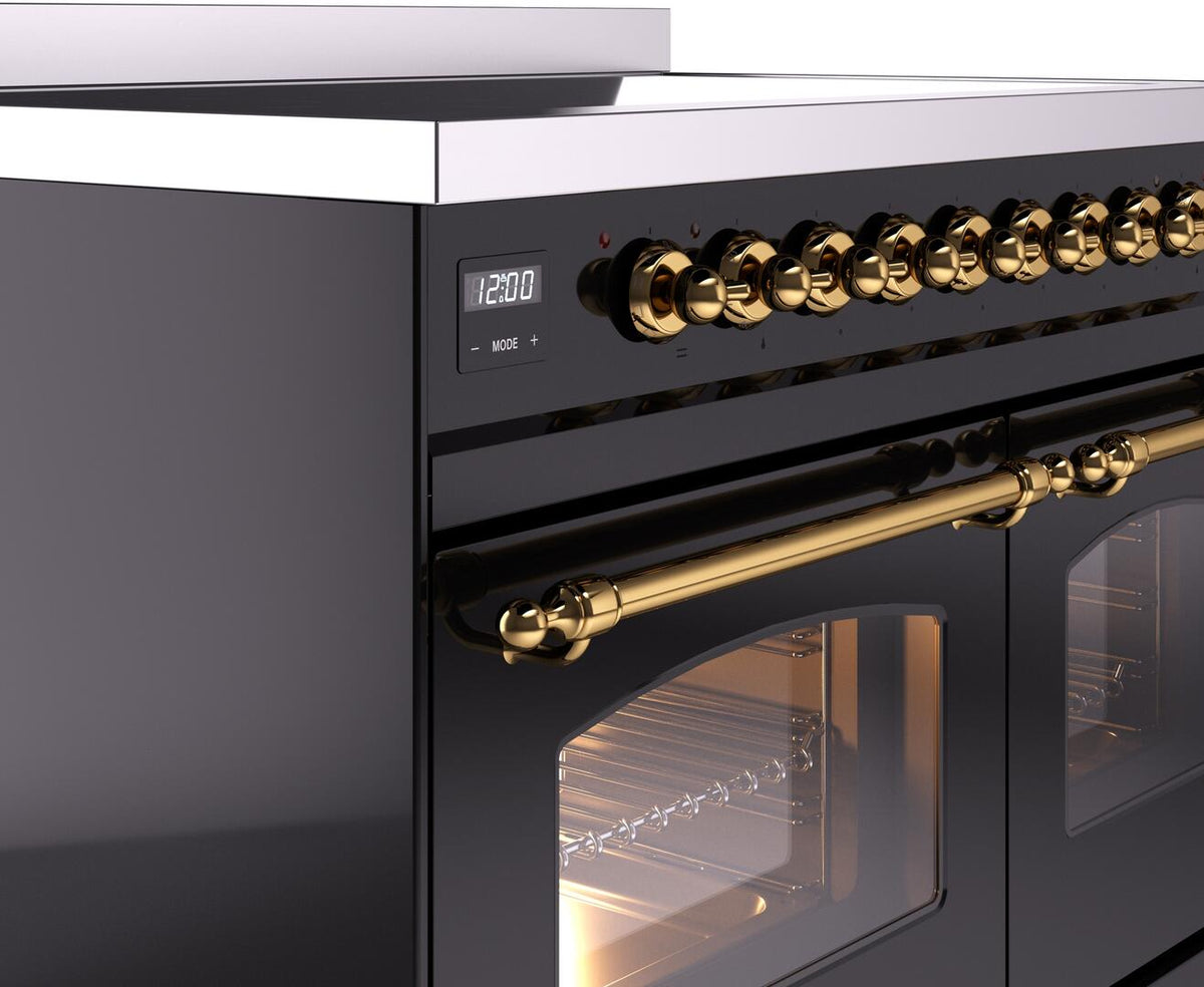 Freestanding range control panel with brass rotary knobs and brass oven handle; front corner detail.