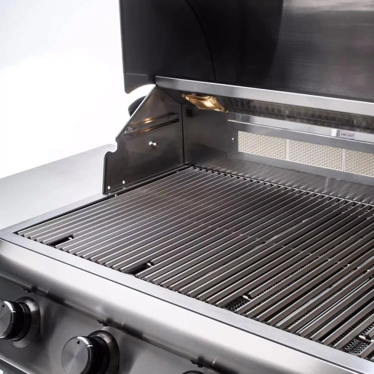 Open hood stainless grill with cooking grates and side burner area