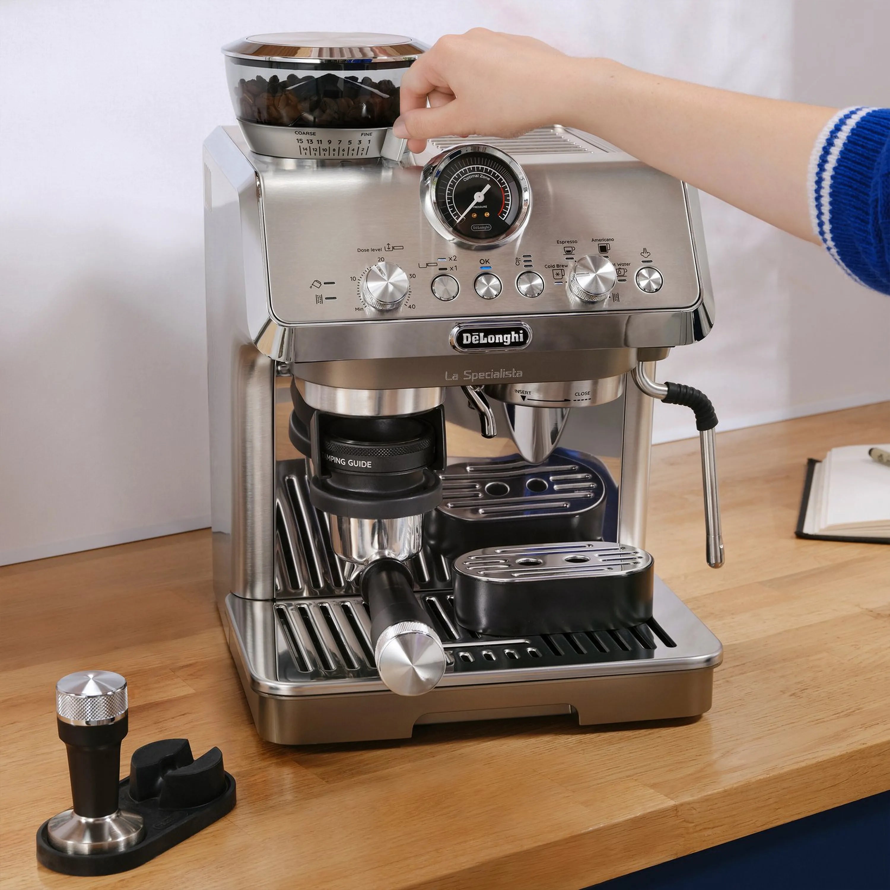 Stainless De'Longhi La Specialista Evo espresso machine with cold brew accessory, front view.