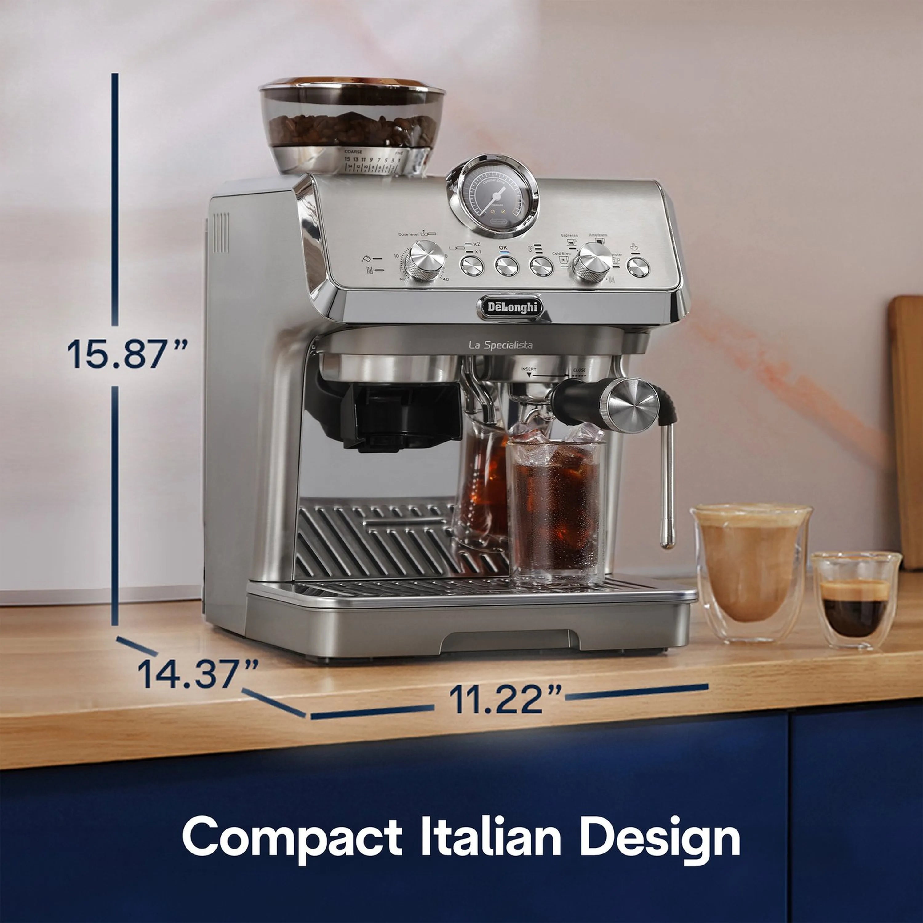 Stainless coffee machine on countertop with glass cups and portafilter