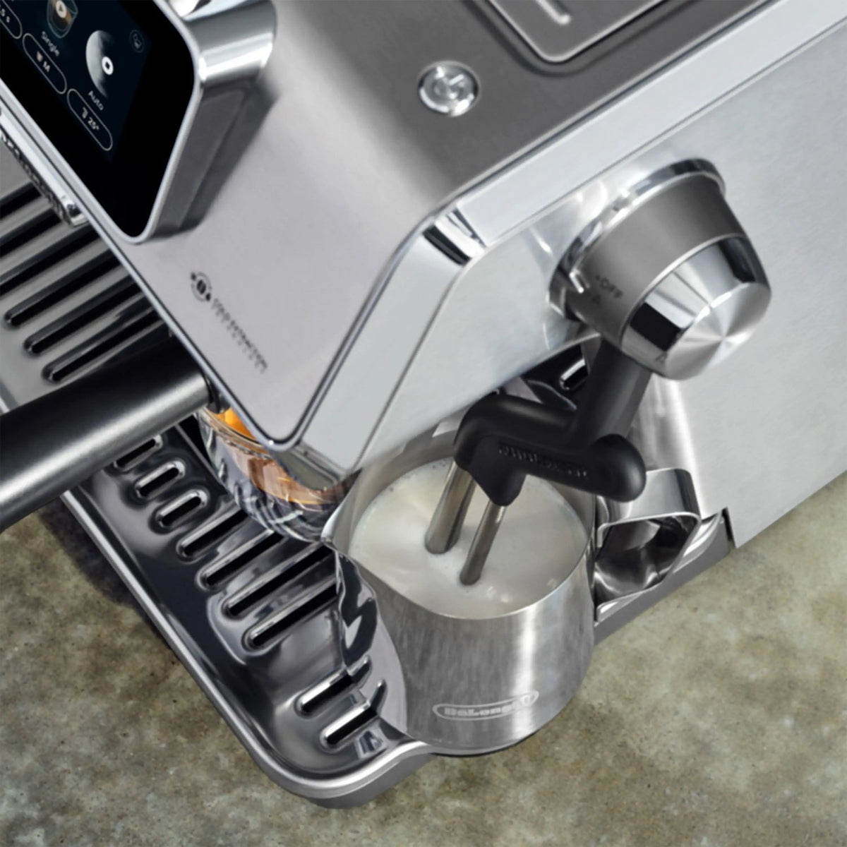 Espresso machine side view with water tank spout and cup on drip tray