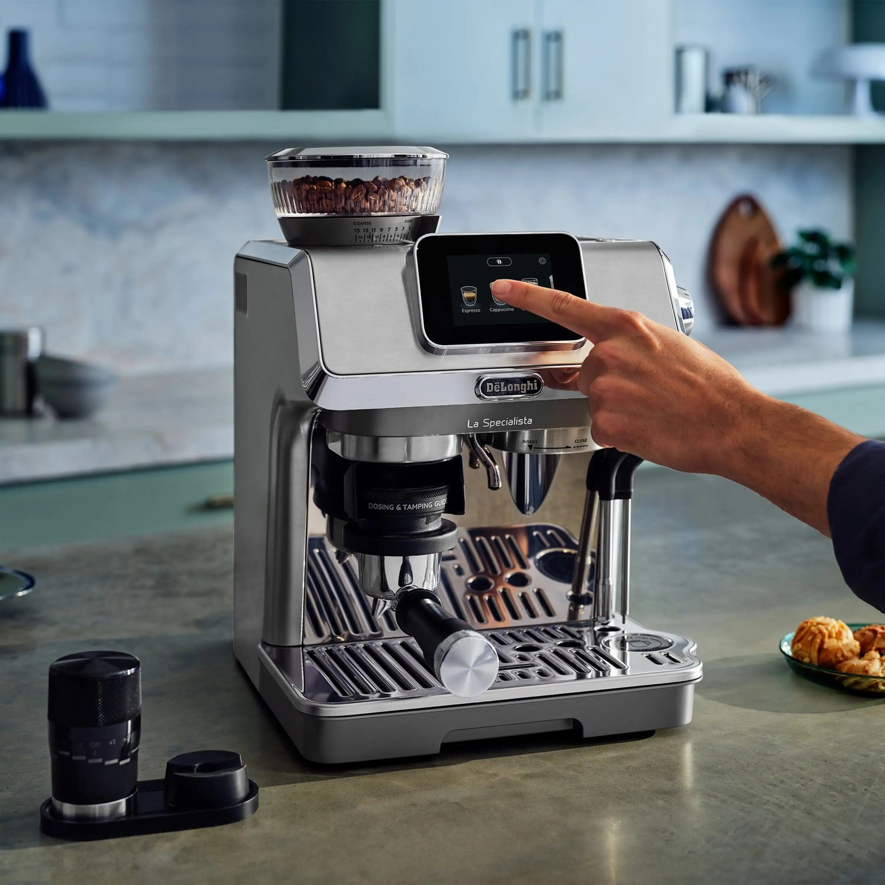 Espresso machine front view with hand selecting settings on the display