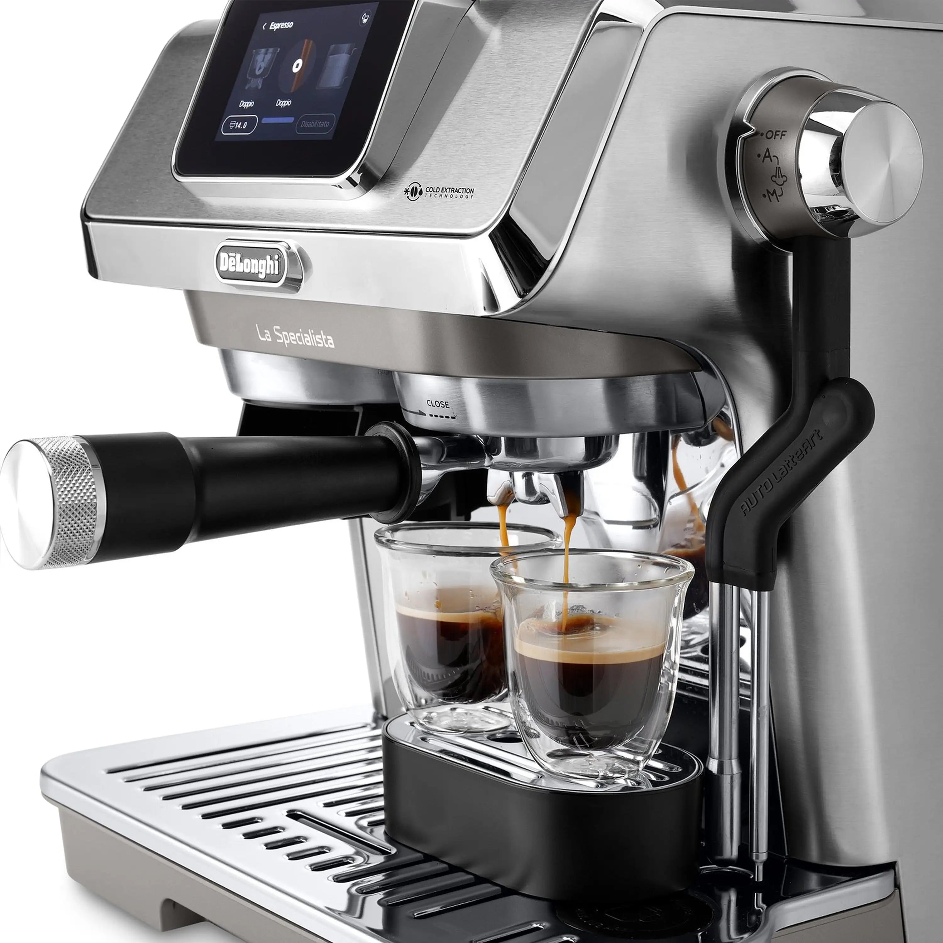 Stainless espresso machine with spouts and glass cups; milk pitcher pouring